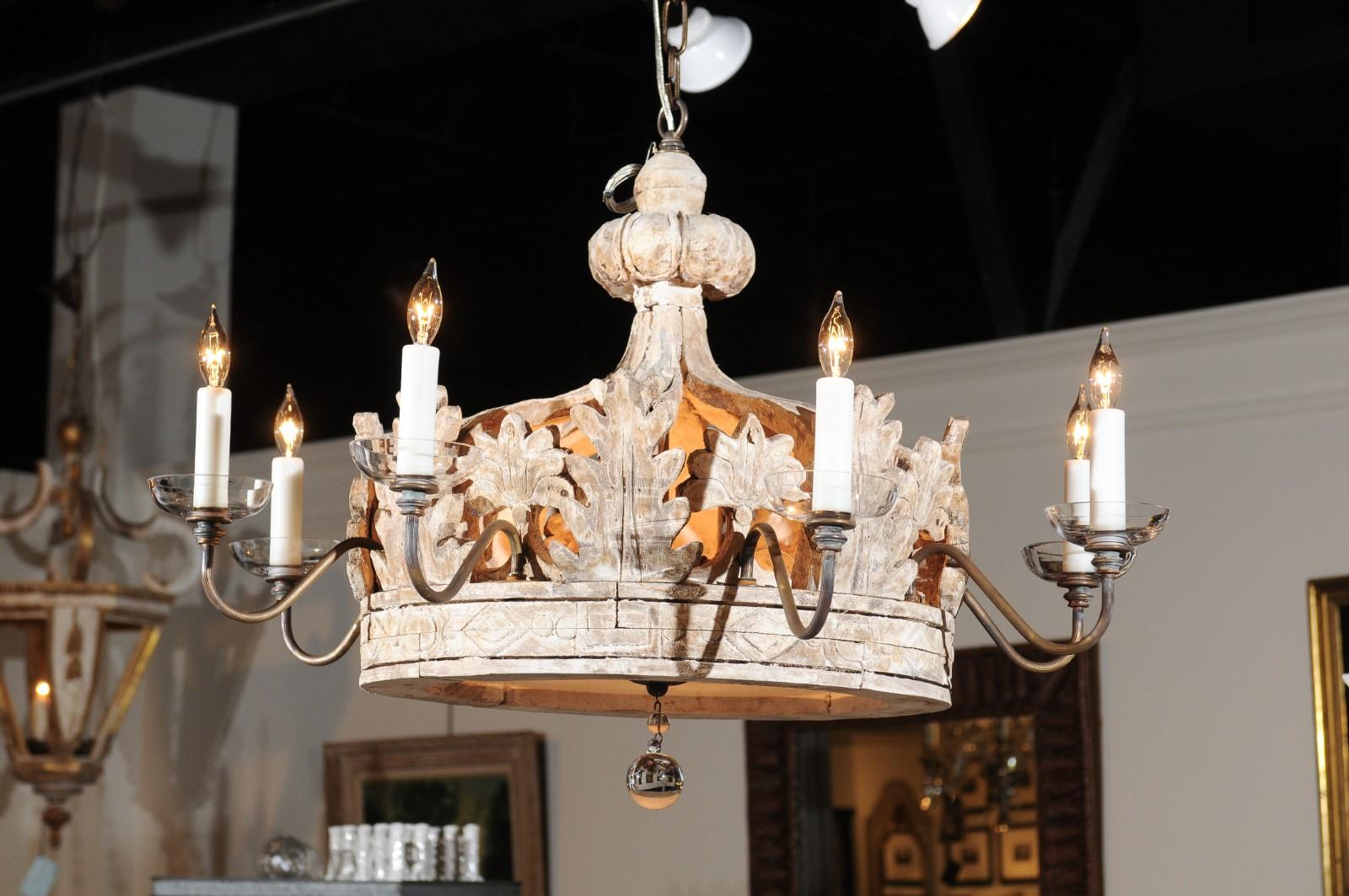 A contemporary Baroque style custom made carved wooden eight-light chandelier with foliage, scrolling arms and frosted section. This exquisite newly made wooden chandelier features the stylistic traits of the Italian Baroque period. Boasting an