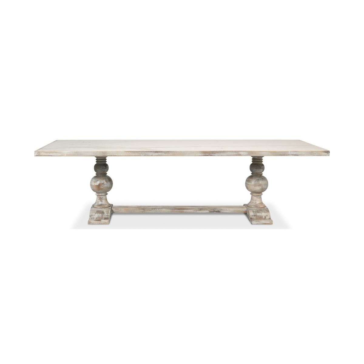 Dining Table with a Calacatta porcelain inlaid top, on a turned baluster form double pedestal base with a hand rubbed and antiqued grey painted finish.

Dimensions: 108