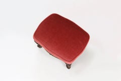 Baroque style foot stool in carved wood with coral velvet upholstery