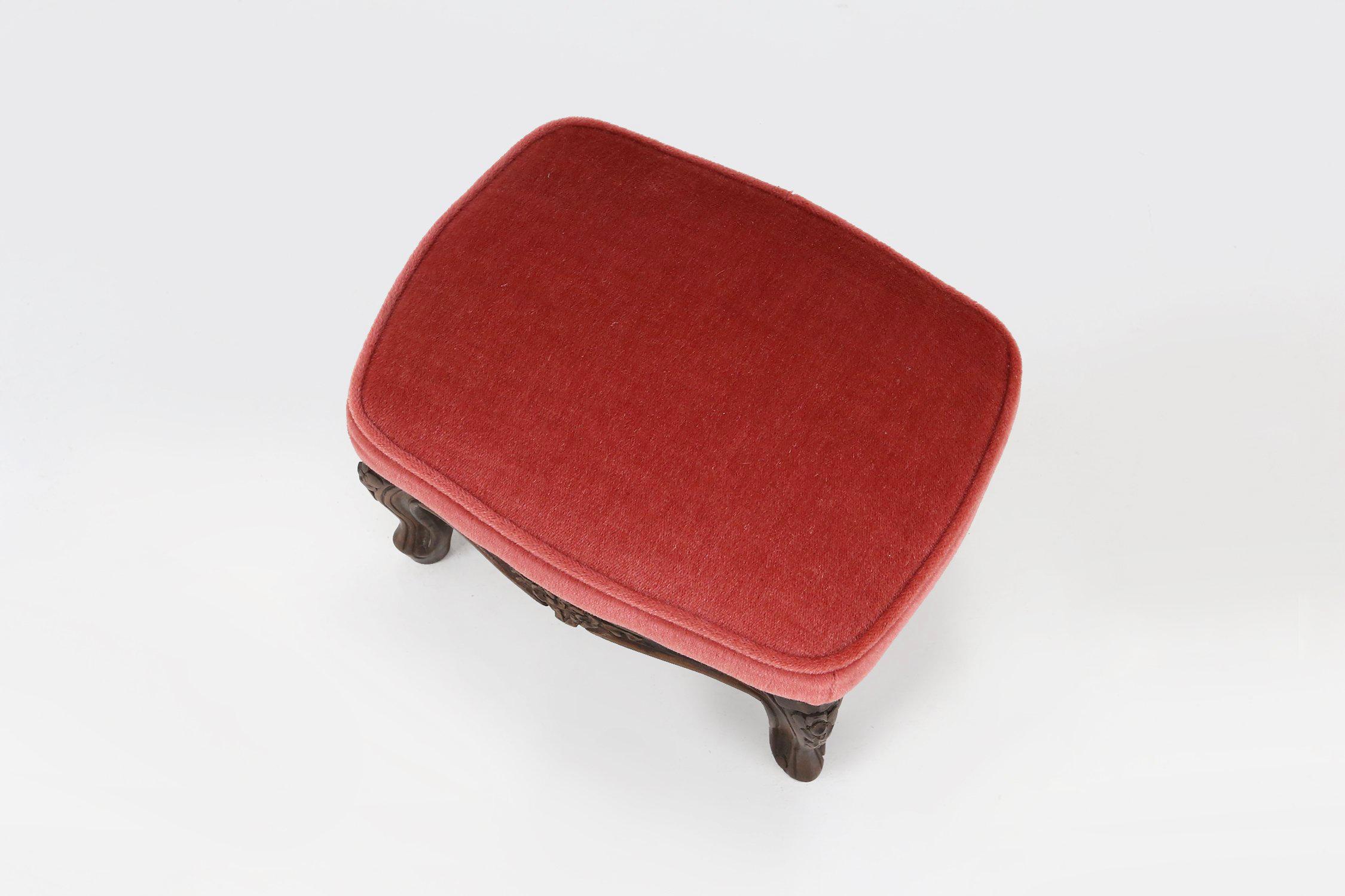 Belgian Baroque style foot stool in carved wood with coral velvet upholstery For Sale