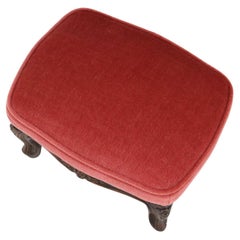 Baroque style foot stool in carved wood with coral velvet upholstery