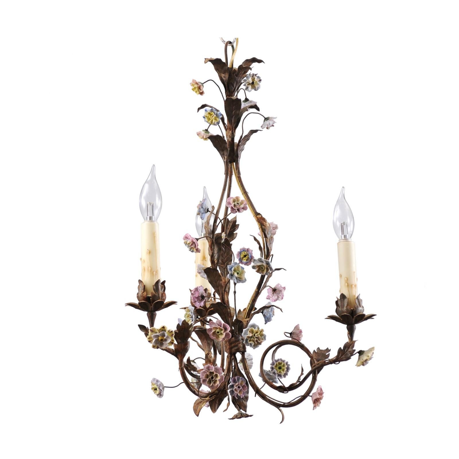 A French Baroque style three-light chandelier from the 20th century with pink and blue flowers, rewired for the USA. This French Baroque style chandelier, hailing from the 20th century, is a picturesque amalgamation of elegance and artisan