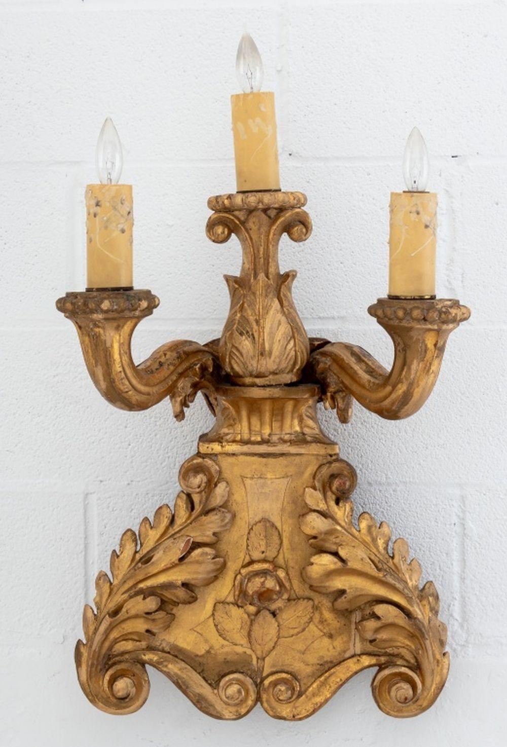 Pair of Baroque Style Giltwood Candelabra Sconces, 19th century, each with two fluted arms and lights, rose and foliate carvings. 29.5