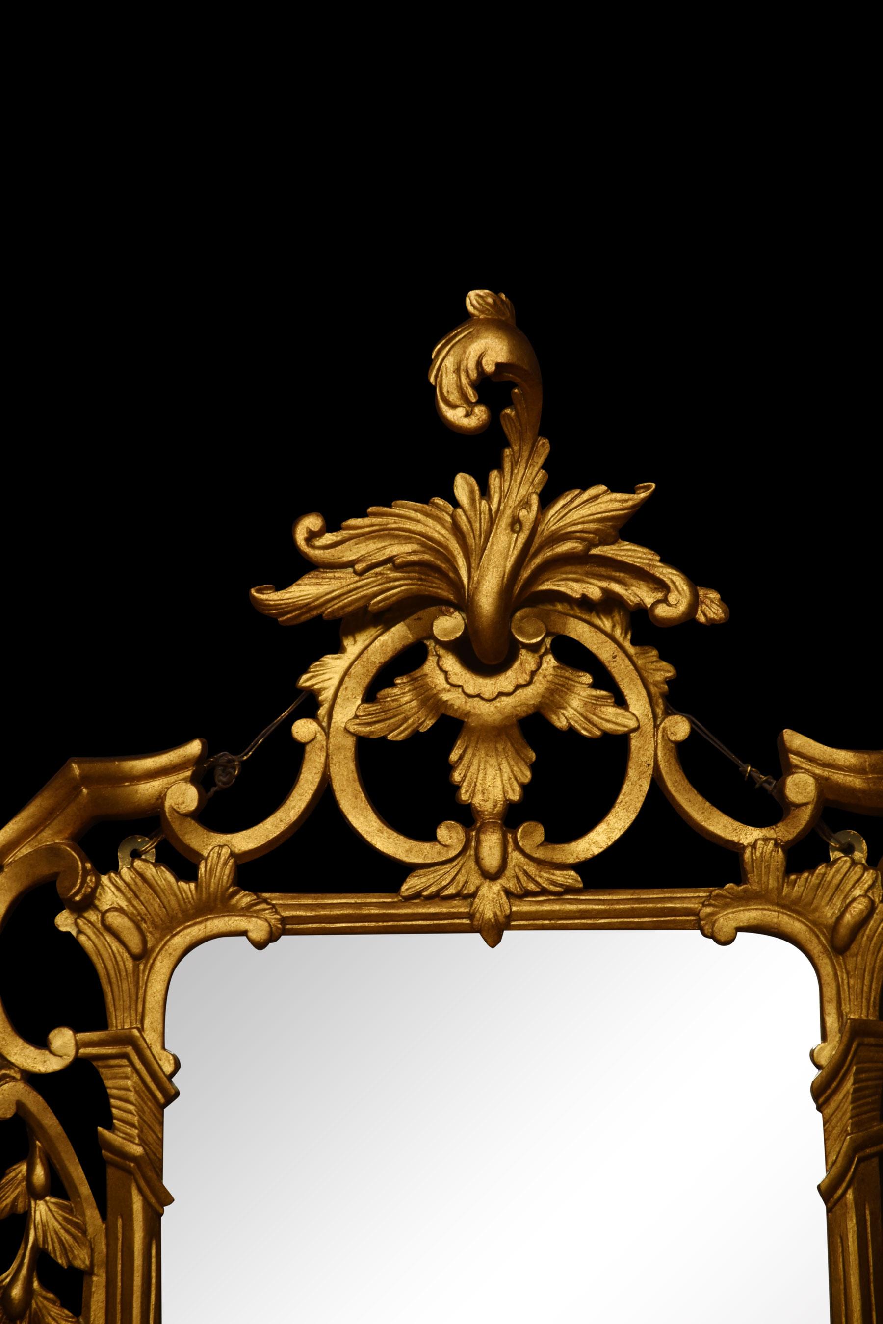 Baroque style giltwood mirror, the original rectangular mirror plate surrounded by a carved and pierced frame with rocaille work and scrolls, surmounted by scrolling acanthus leaves.
Dimensions
Height 44 Inches
Width 22 Inches
Depth 4 Inches.