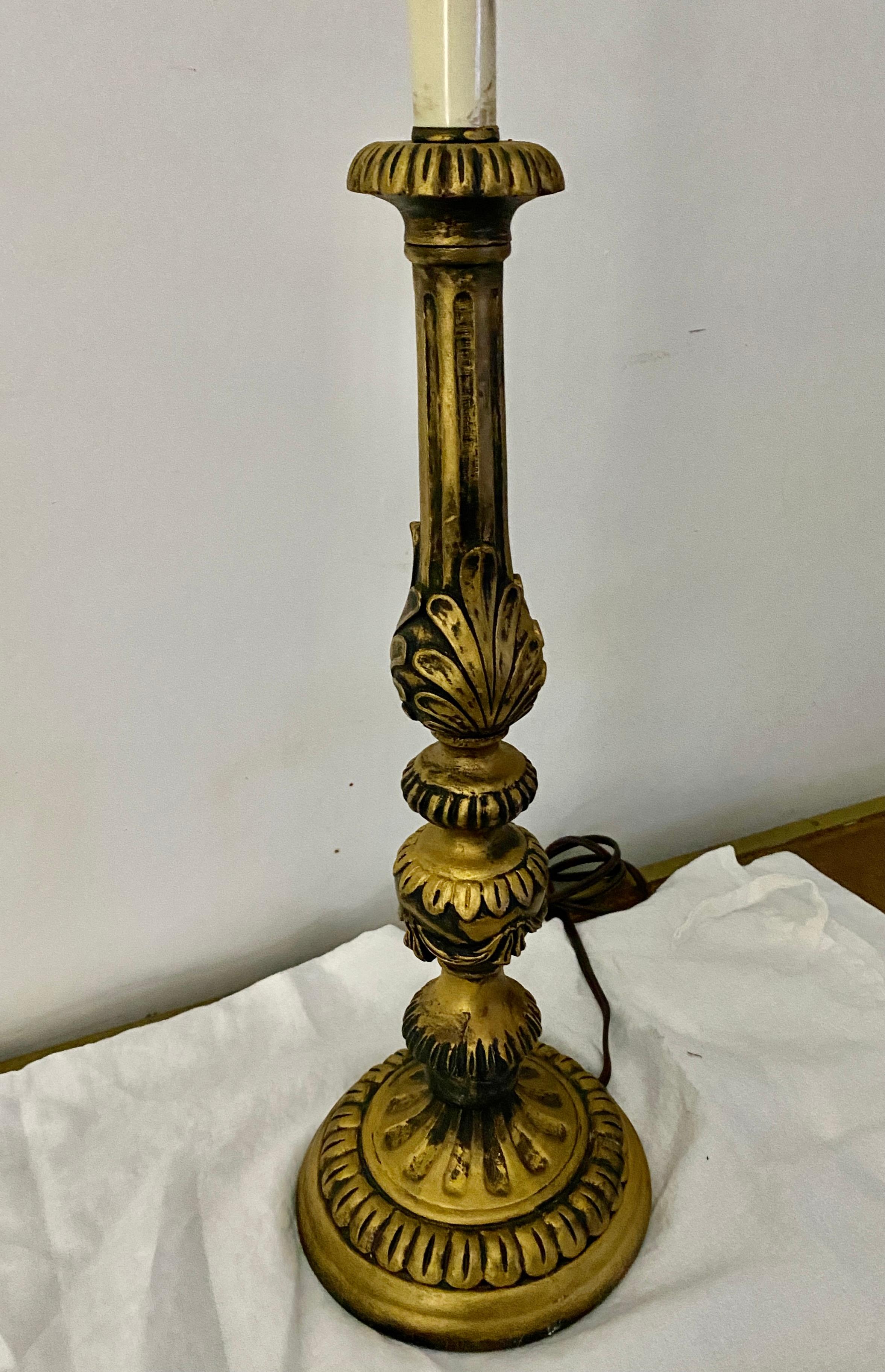 A wonderful vintage Italian baroque style gilt wood candlestick table lamp makes a wonderful addition in any room.
Search term: Hollywood Regency, rococo style lamp.