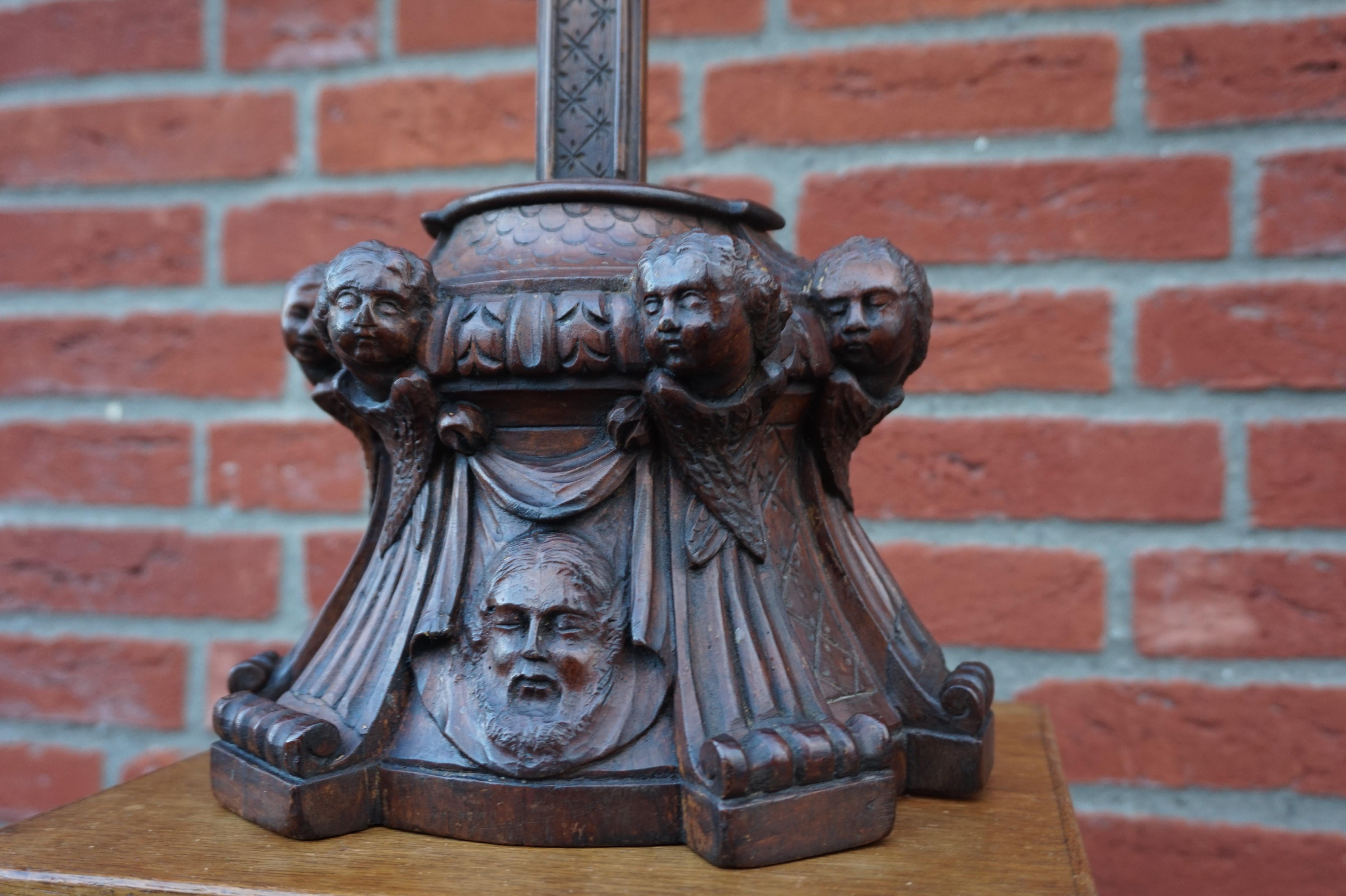 Crucifix from the mid-1800s with a carved shroud or veil depicting Christ in the base.

This unique and remarkable antique crucifix can both be used as a table and as a wall crucifix. Over the decades we have sold a number of unique and very well