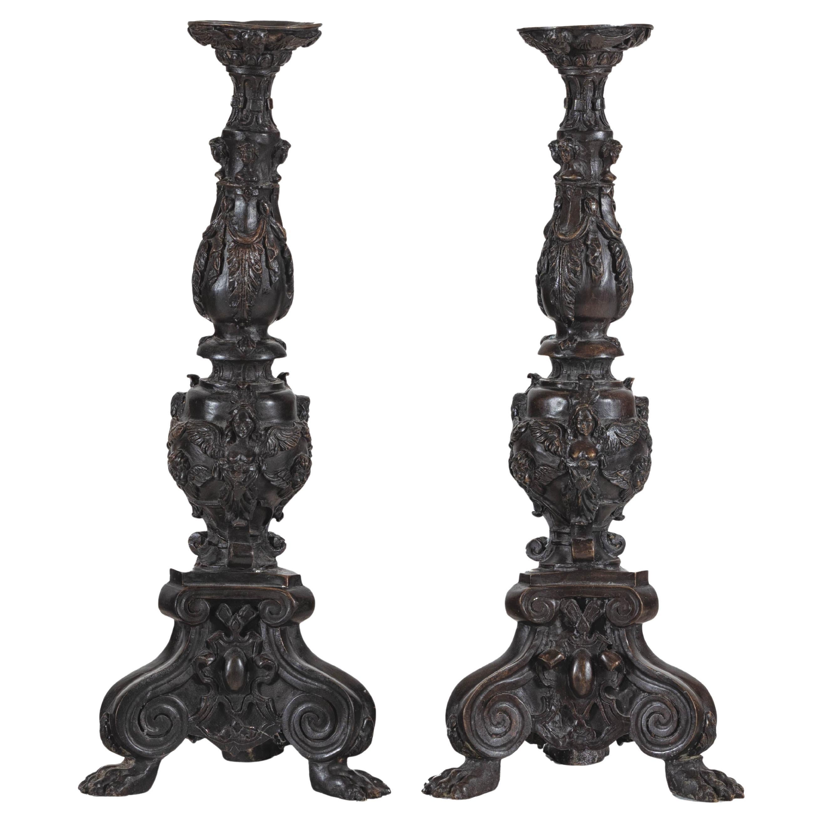 Baroque-Style Ornate Metal Candlesticks with Cherub, Volute and Garland Motifs