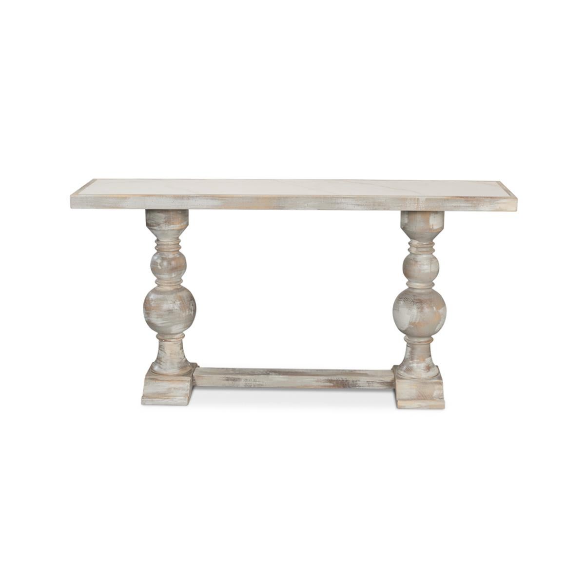 With a hand-rubbed and antiqued grey painted finish, the top inset with Calacatta gloss porcelain, raised two turned baluster legs with a stretcher base.

Dimensions: 61