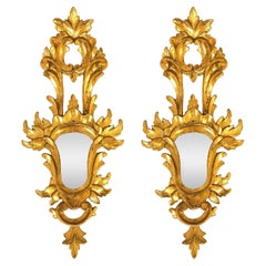 Baroque style. Pair of gilded cornucopia mirrors, France, 1920s