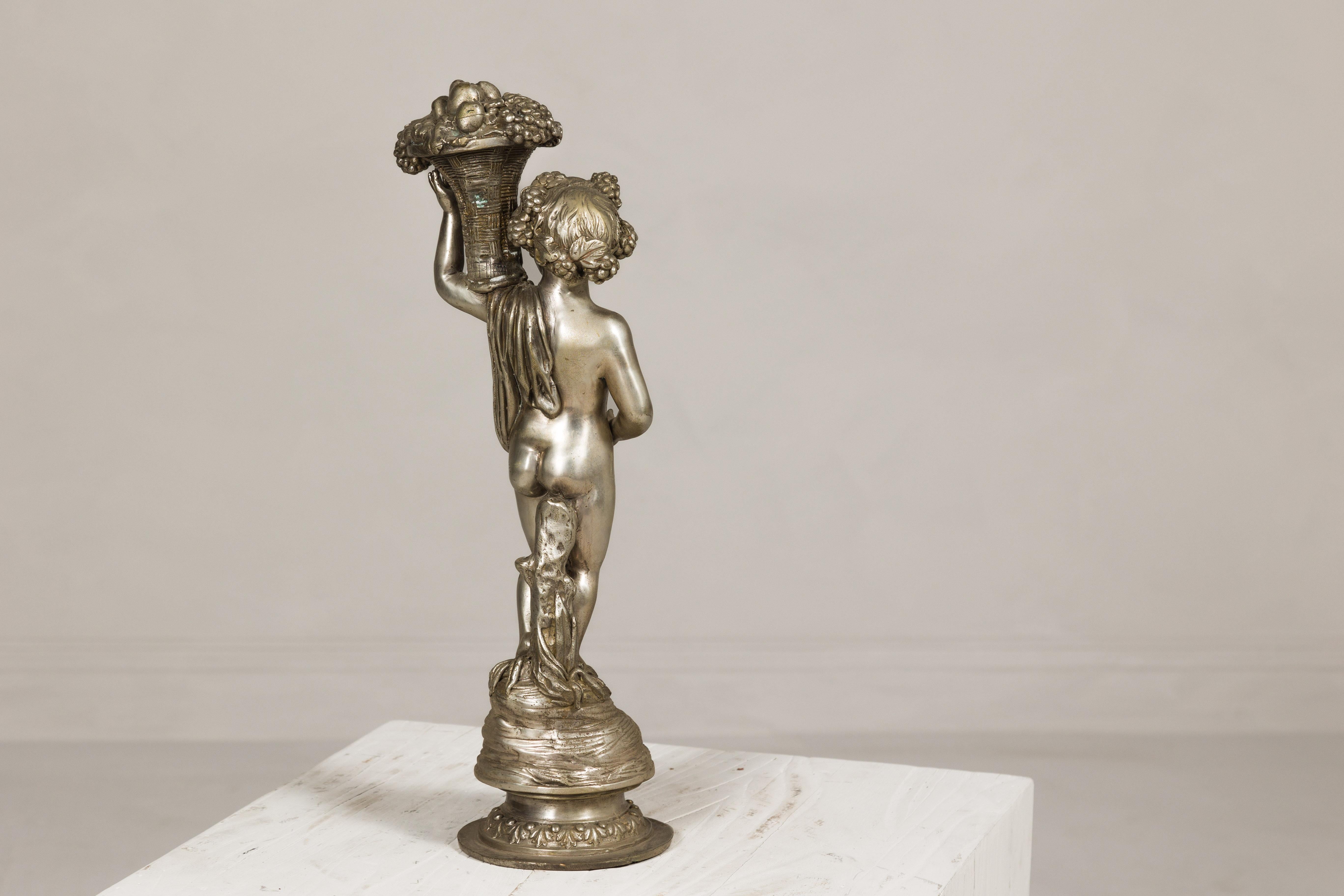 Baroque Style Silvered Bronze Statuette of a Putto Carrying a Fruit Basket For Sale 7