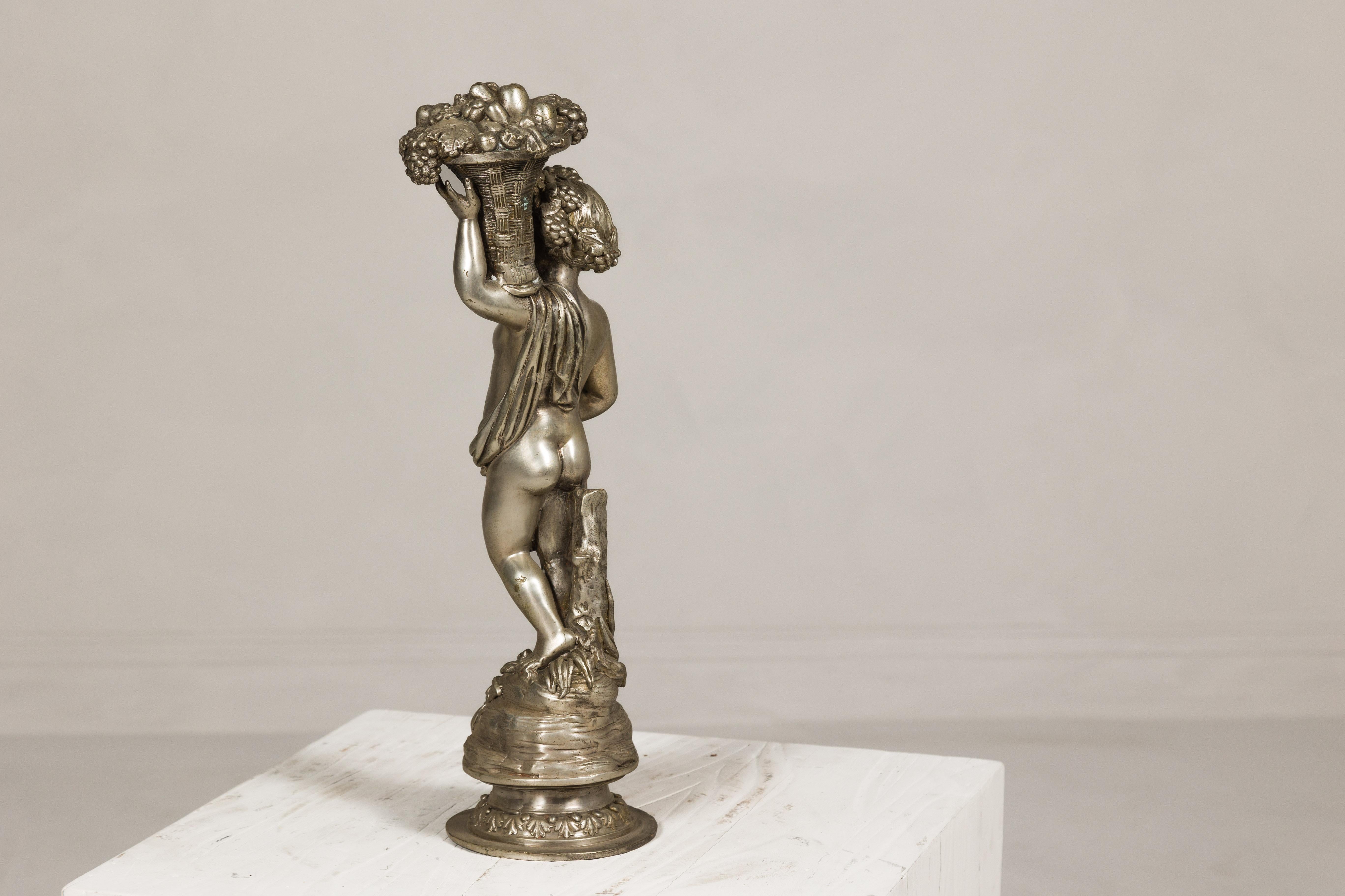 Baroque Style Silvered Bronze Statuette of a Putto Carrying a Fruit Basket For Sale 8