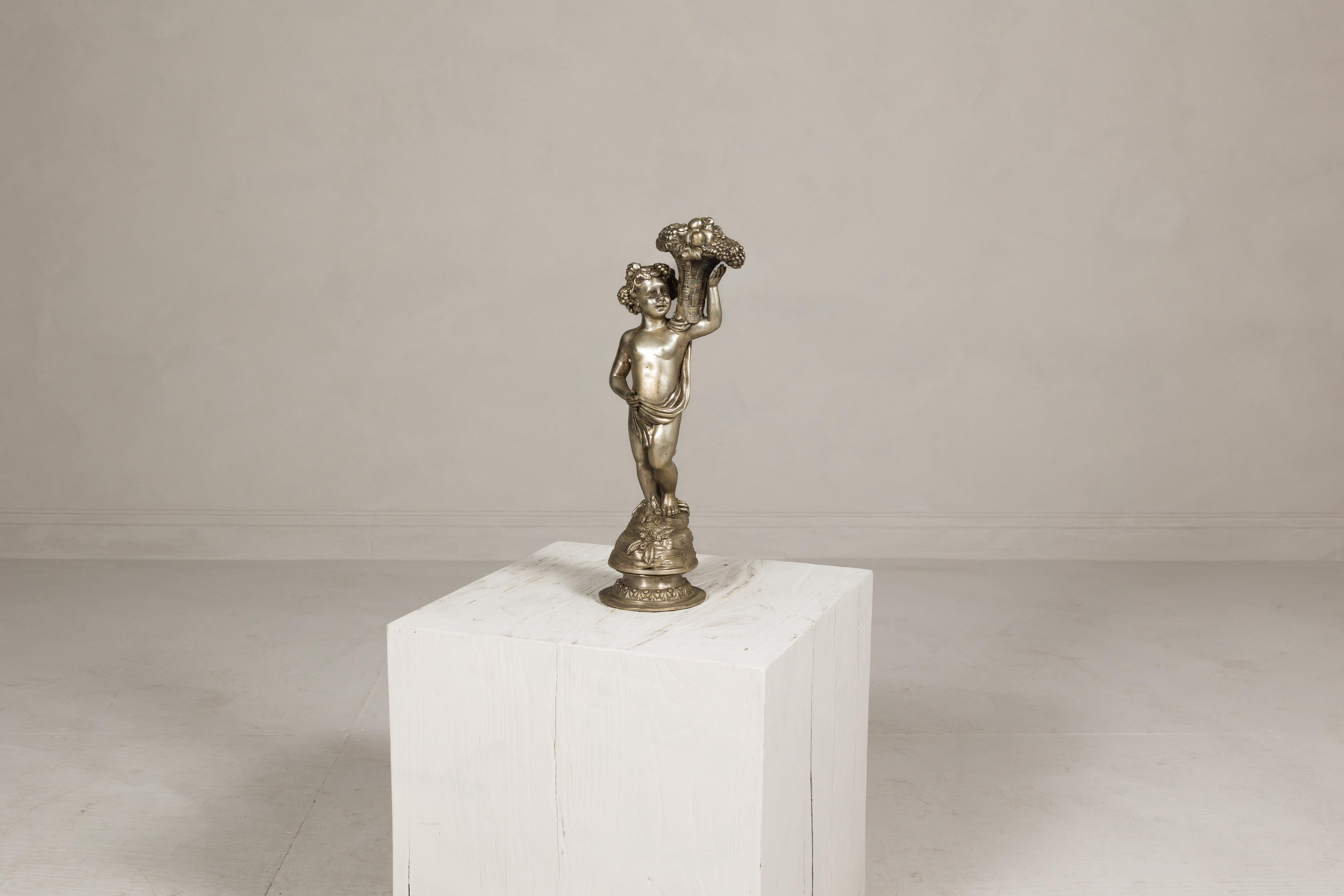 Baroque Style Silvered Bronze Statuette of a Putto Carrying a Fruit Basket For Sale 3