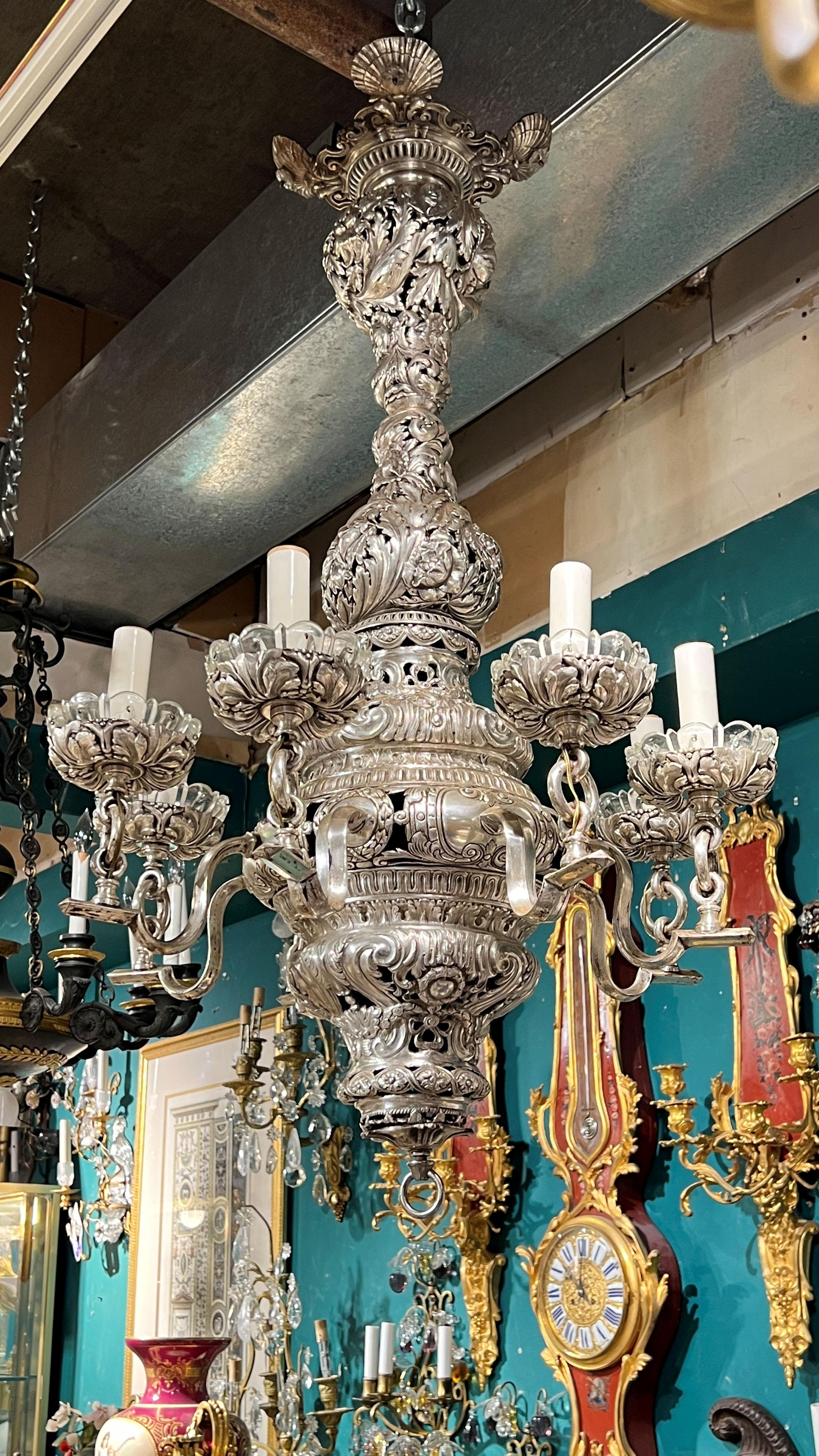 Great quality Baroque Revival Silvered Metal Chandelier with eight electrified candles and molded glass drip pans .
With sea shell motifs 