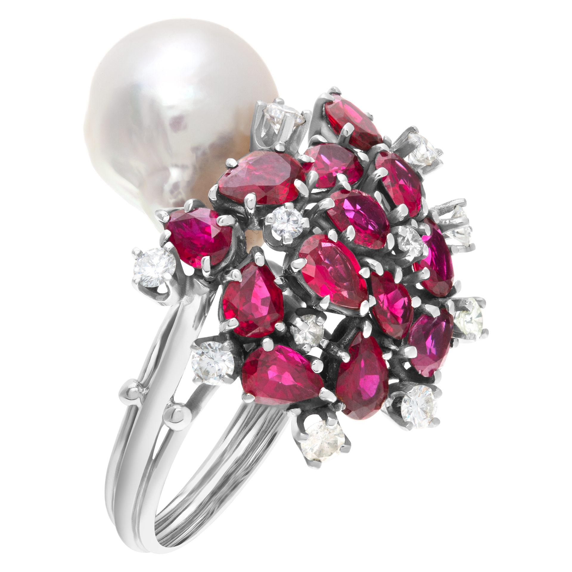 Baroque style South Sea pearl (12.9 x 15.6mm) ring in 14k white gold with multi cut rubies & approximately 0.30 carats in round diamond accents. Size 8.

This Diamond/Ruby/Pearl ring is currently size 8 and some items can be sized up or down, please