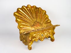 Baroque-style table lectern in carved and gilded wood, 18th century.