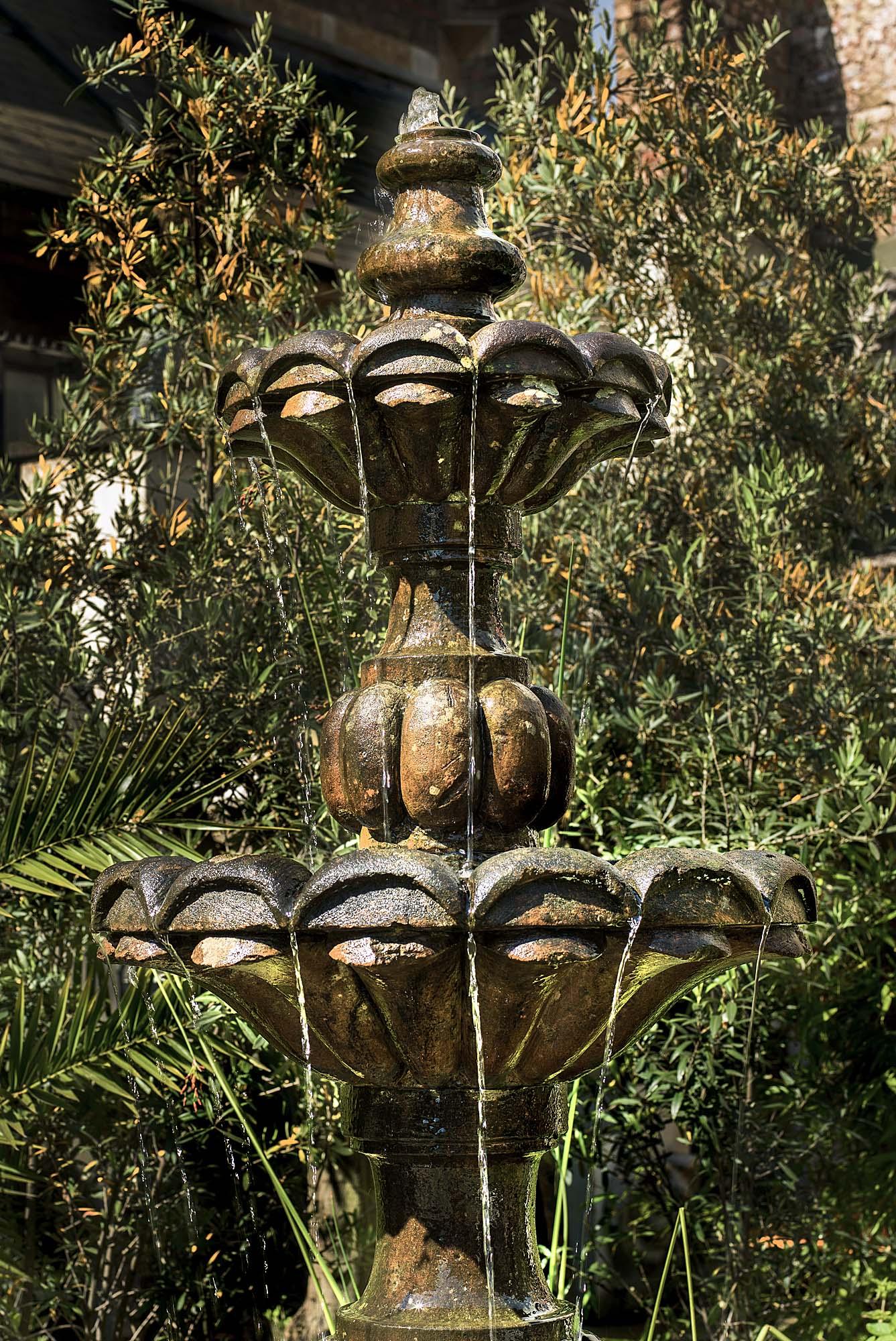 A rather fine Baroque style three-tier garden fountain carved in patinated Doddington Sandstone. The three strongly carved ascending bowls each rest on ornate and sturdy baluster stems. As the water flows the air is filled with the soothing and