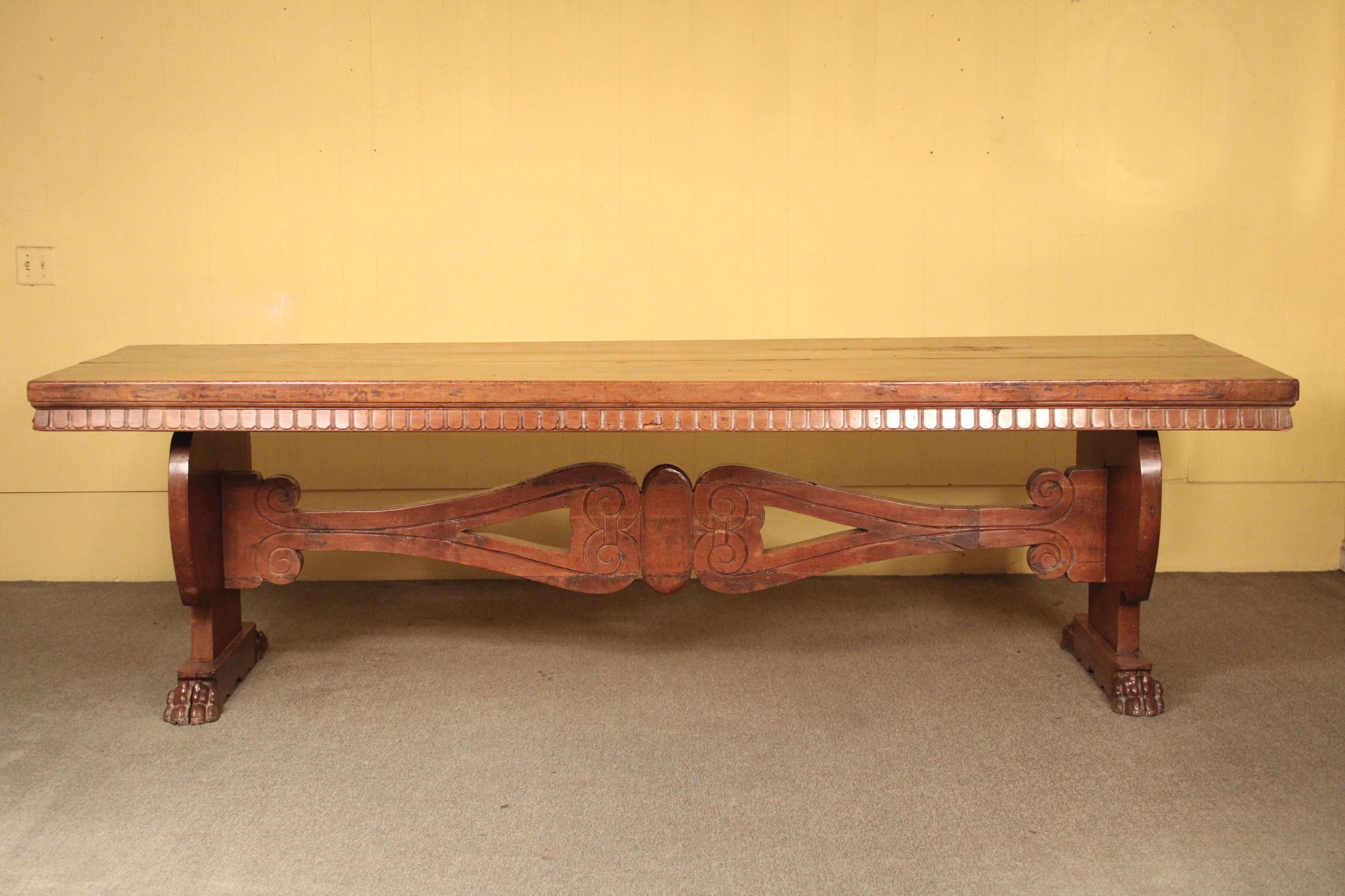 Italian baroque style walnut dining room table, made from antique elements, probably assembled circa 1920's. With a rectangular 111