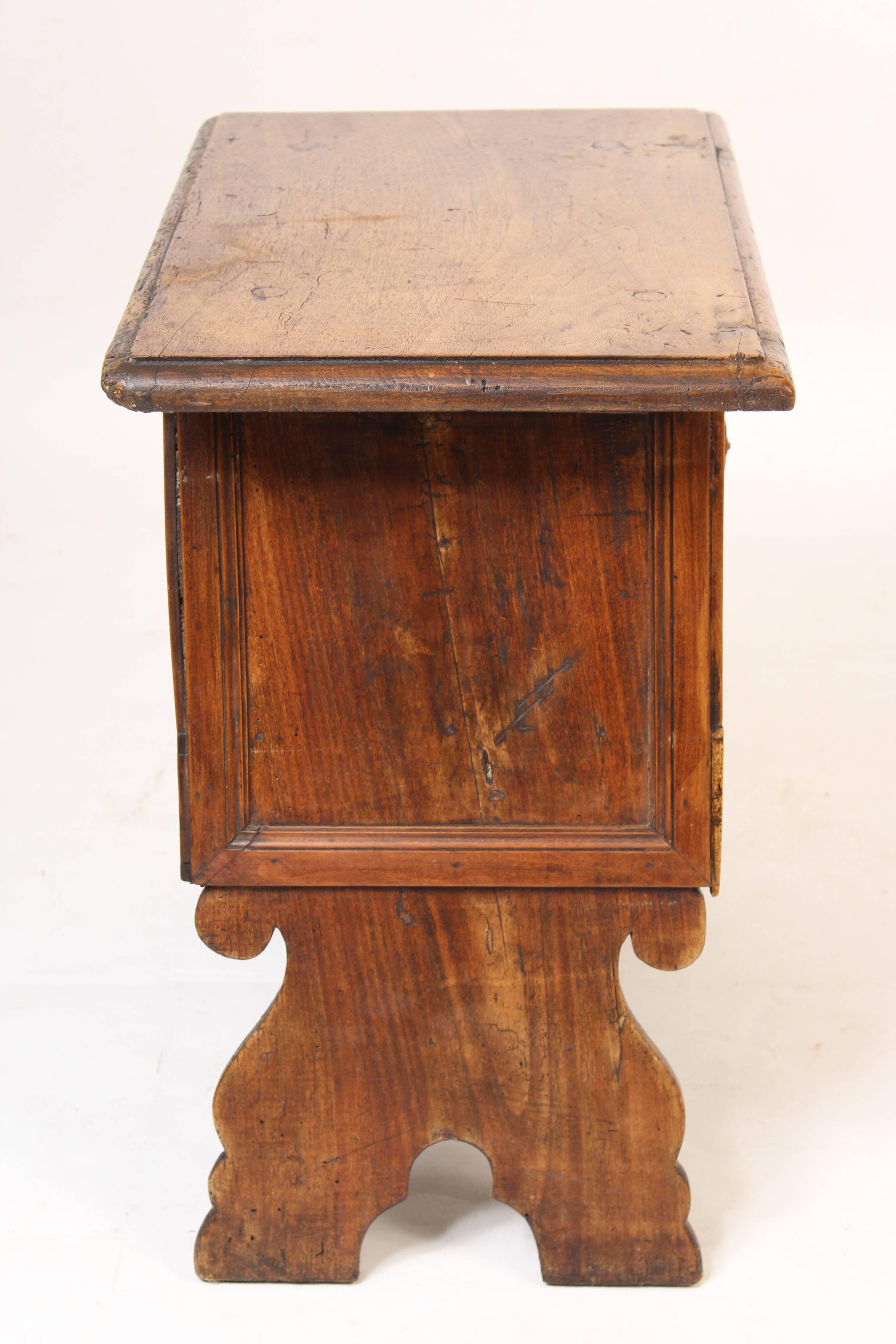 Continental antique Baroque style single door occasional table, circa 1890-1910. The walnut on this table has excellent old color.