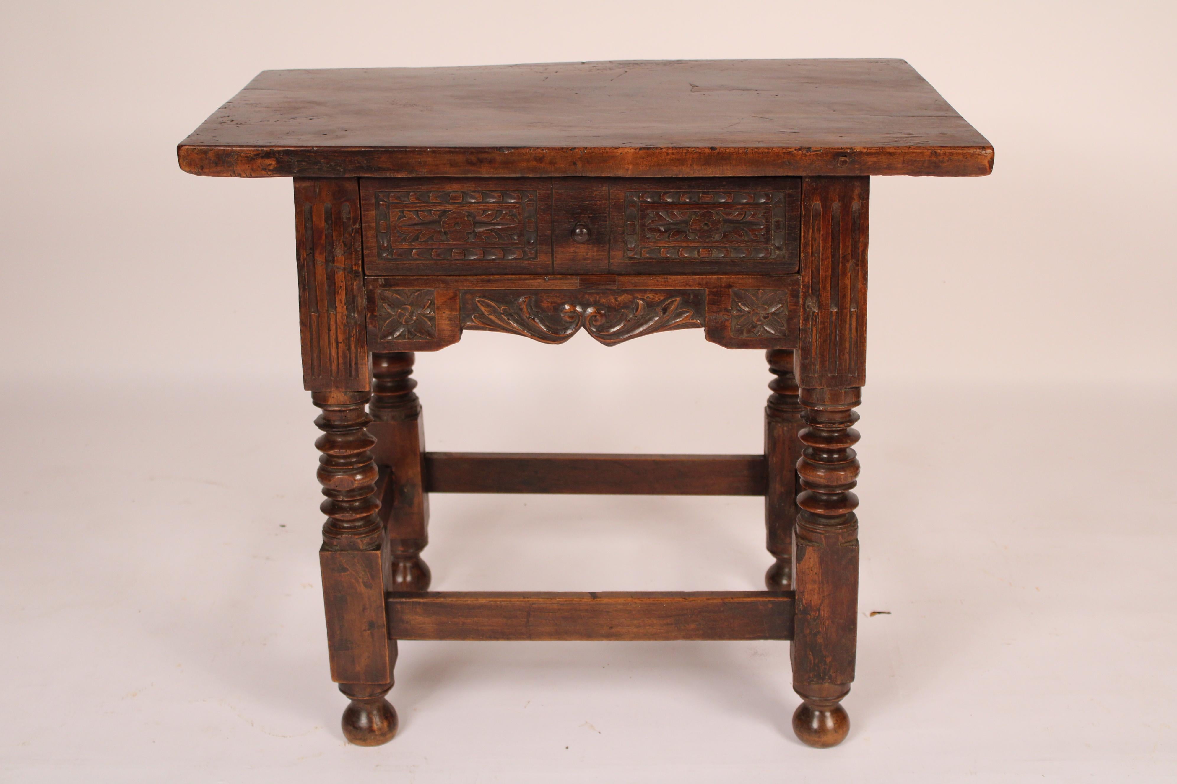 Italian baroque style walnut occasional table, made from antique and later elements, probably assembled circa 1920. With a 1.25