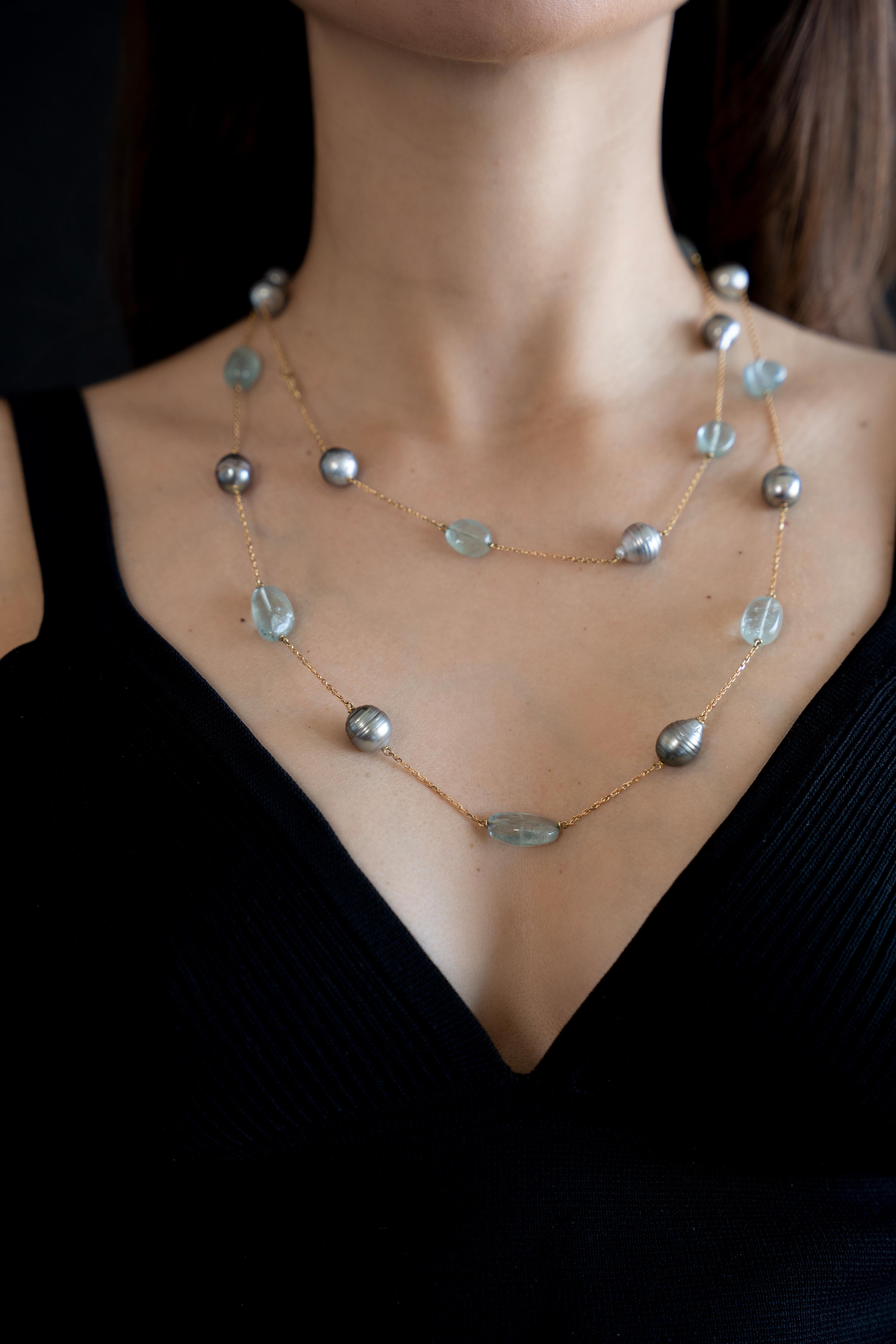 Light blue and grey colored long necklace. Twelve Tahiti pearls, eleven aquamarine tumbles,
18K yellow gold. Created by Marion Jeantet.

Total weight: 44.12grs
French assay mark
Price without local taxes
Aquamarine's weight: 80.08 carats