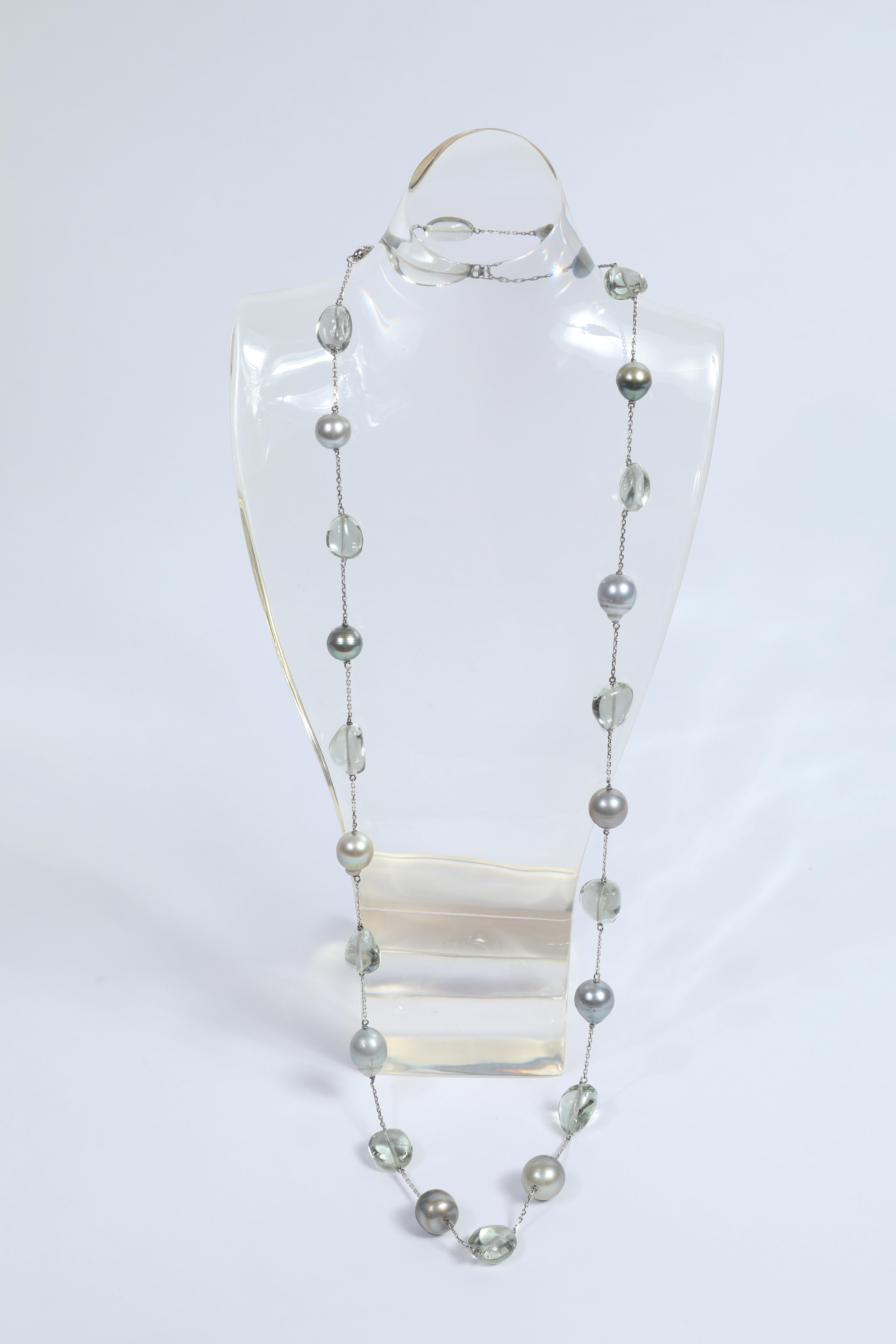 Luminous and soft cameo of green and grey colored long necklace. 
Eleven Tahiti pearls and twelve green quartz tumbles on a 18K white gold chain,
created by Marion Jeantet
Total weight: 52.20grams
Green quartz weight: 78.05carats
French assay mark