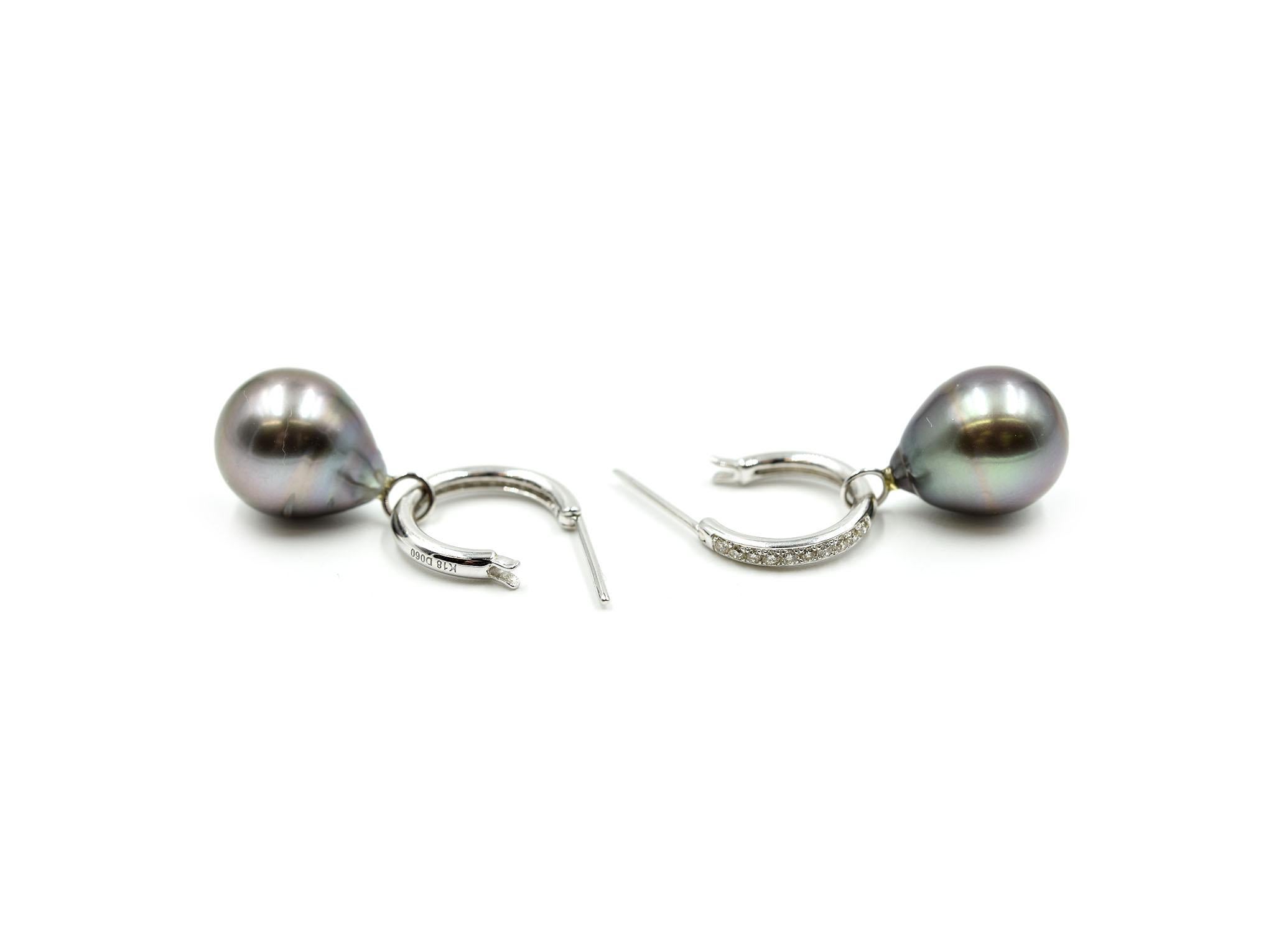 Designer: custom design
Material: 14k white gold
Pearls: two baroque shaped 12.30mm Tahitian pearls
Fastenings: snap closures
Weight: 8.73 grams
