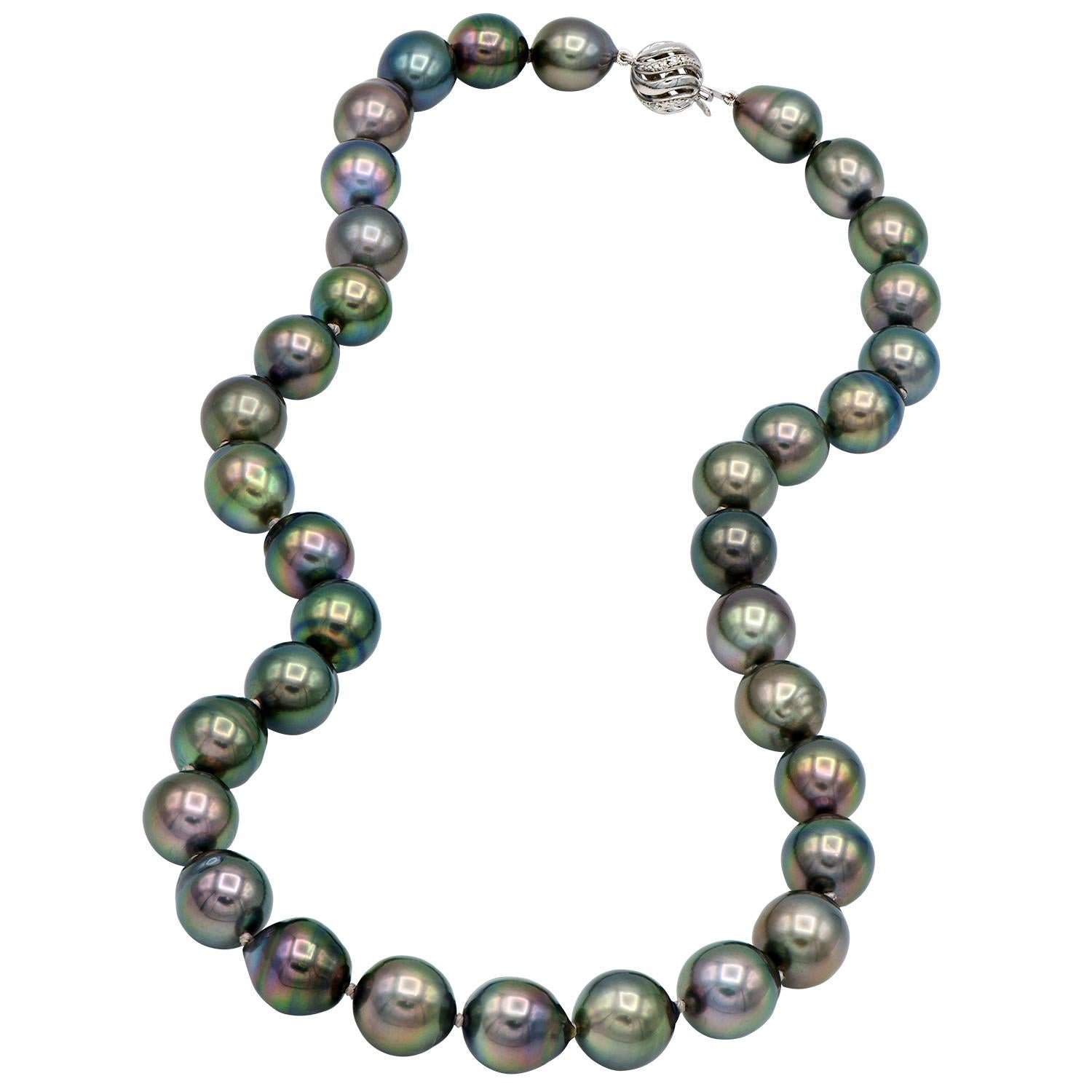 This beautiful strand of Tahitian black pearls is made completely of baroque pearls each giving their own unique shape. The pearls have gorgeous undertones making them seem iridescent and glowing. There are 35 pearls making up this 18 inch strand