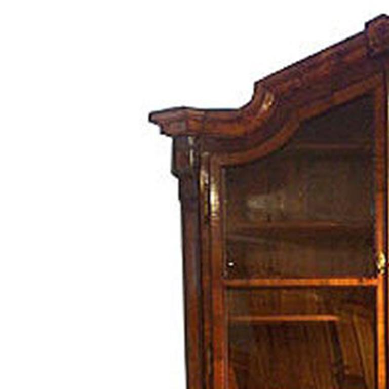 Top section with glass doors and interior shelves.  Bottom section with three large drawers.