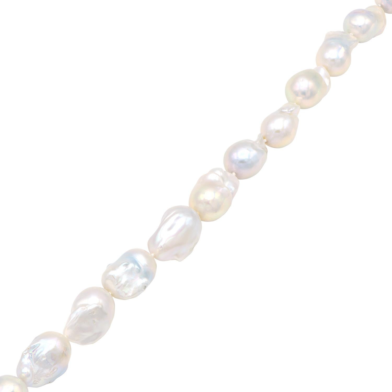 This unique and beautiful necklace is made from large 18-22mm baroque white freshwater pearls. Each pearl has its own unique luster and shape made out of 16 pearls. This necklace is expertly strung with a double knot in between each pearl to make a