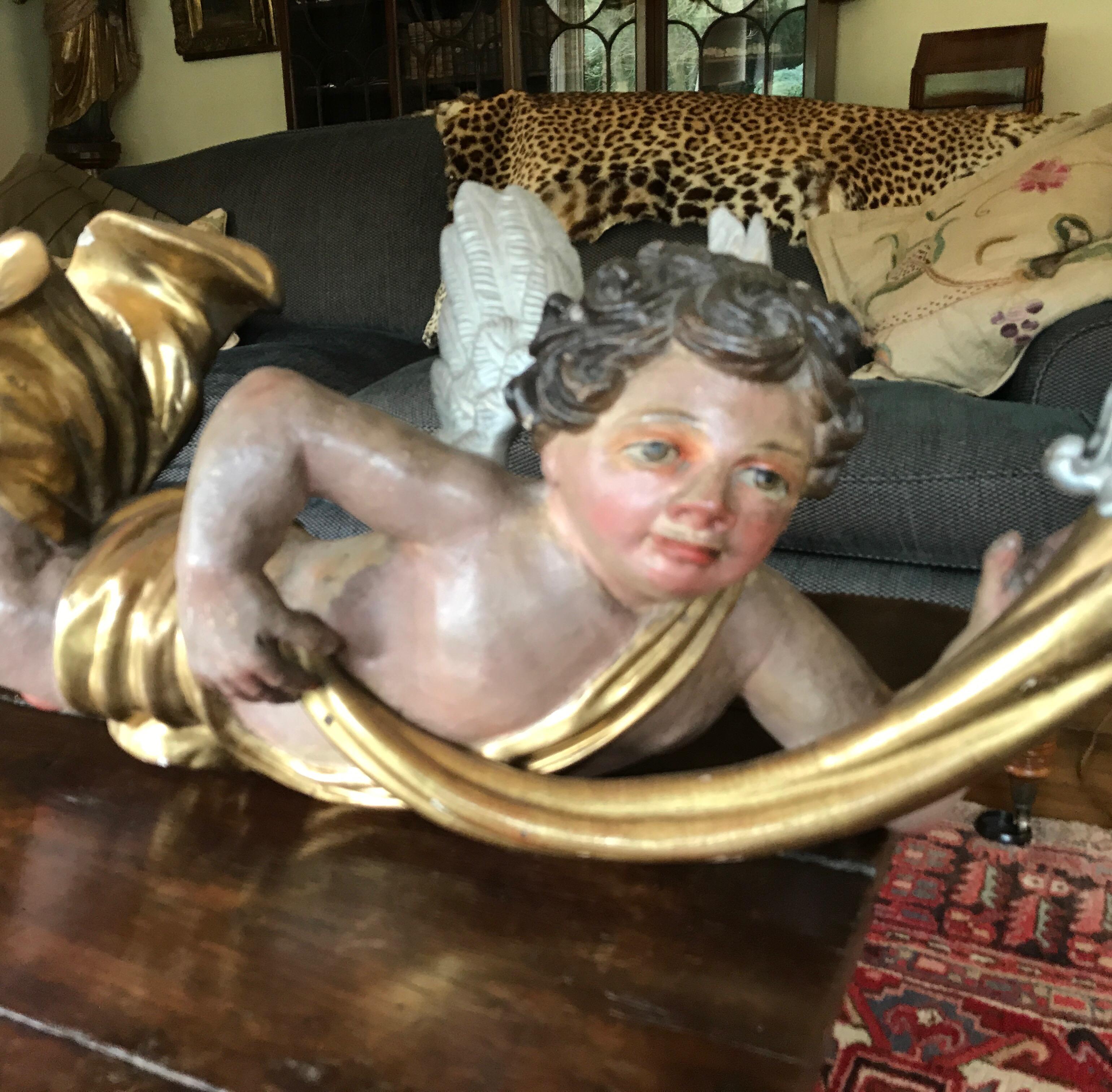 Baroque wooden (limewood) plychrome angel. 

17th century,
wondelfull condition and color 
golden parts perfect 
hook to hang original.