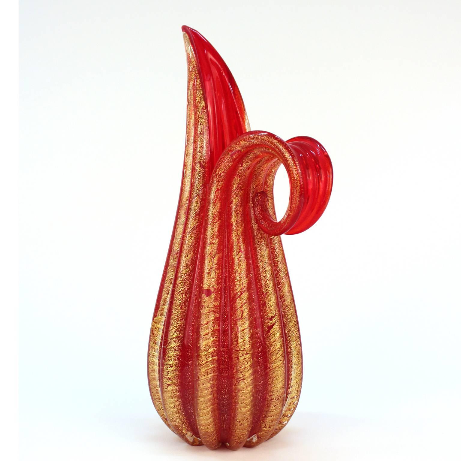A 1930s deco Murano glass red and 24-karat gold vase made by Barovier & Toso.