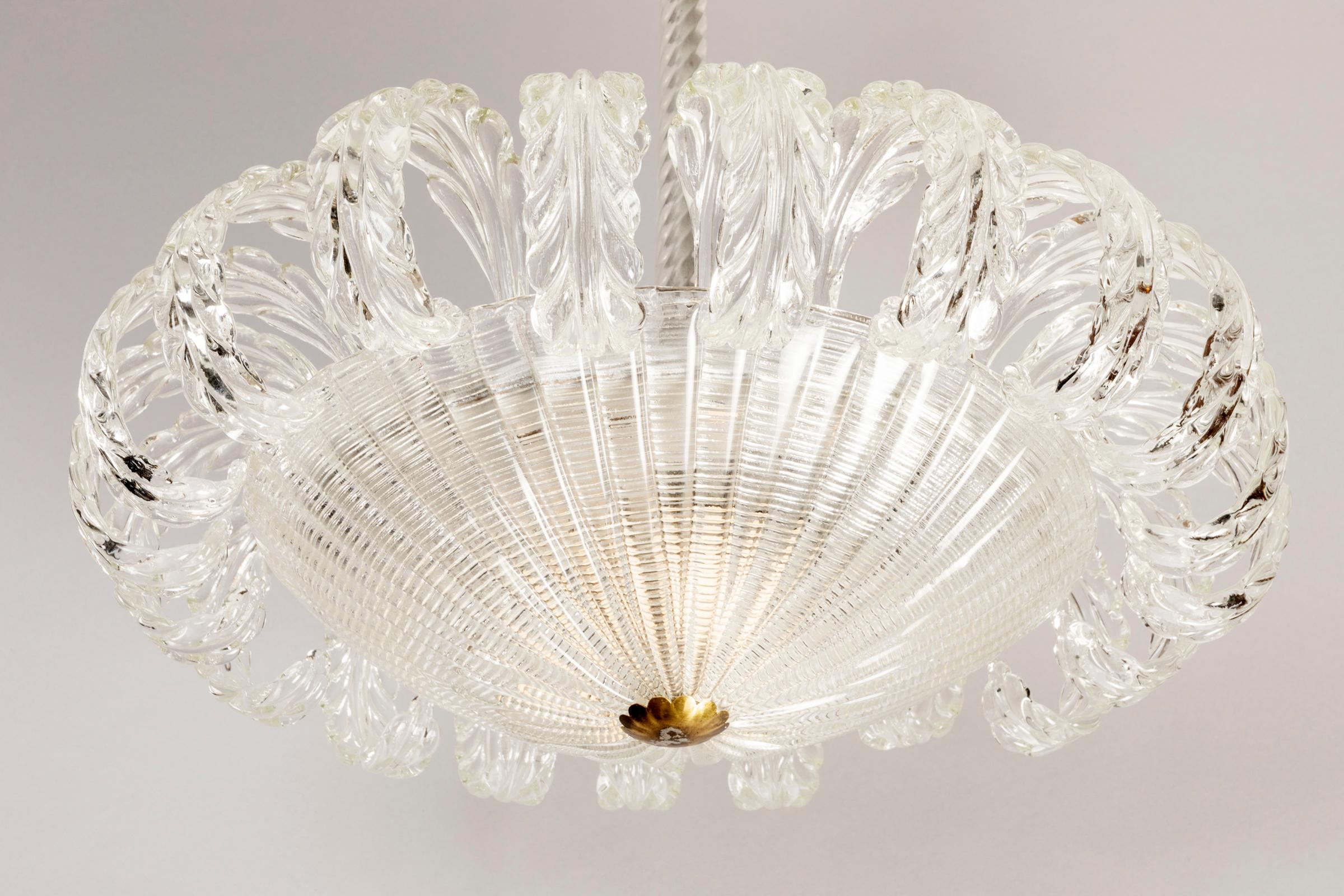 A sophisticated, elegant ceiling light by Barovier and Toso. Famous glass maker factory in Venezia. Made of crystal clear Murano glasses. Italy, 1940.