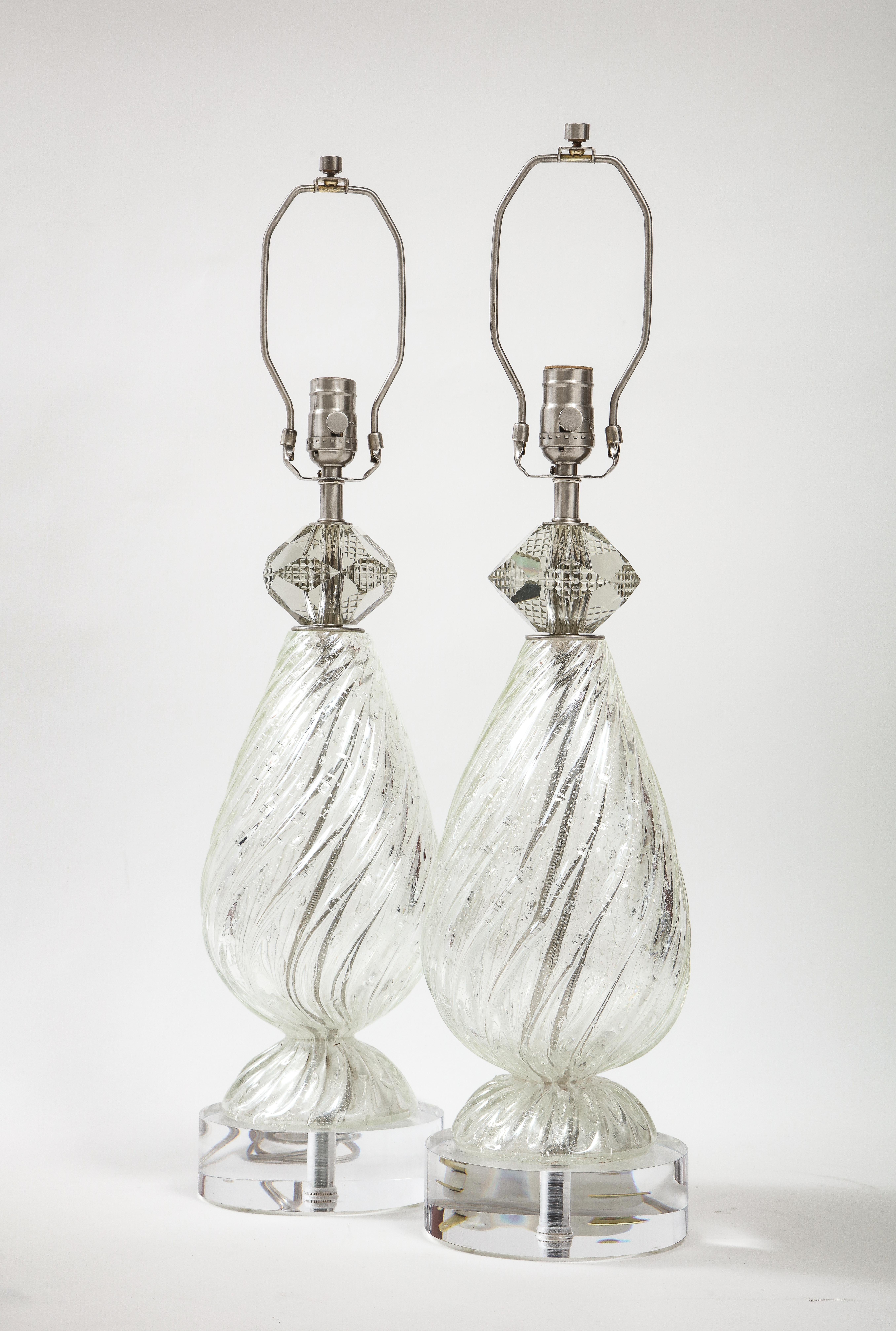 Pair of Mid Century/Art Deco Barovier Murano glass lamps featuring a swirl patterned body with metallic silver fleck inclusions. Lamps are topped by a faceted crystal orb and sit on custom Lucite bases. Rewired for use in the USA, 100W max bulbs.