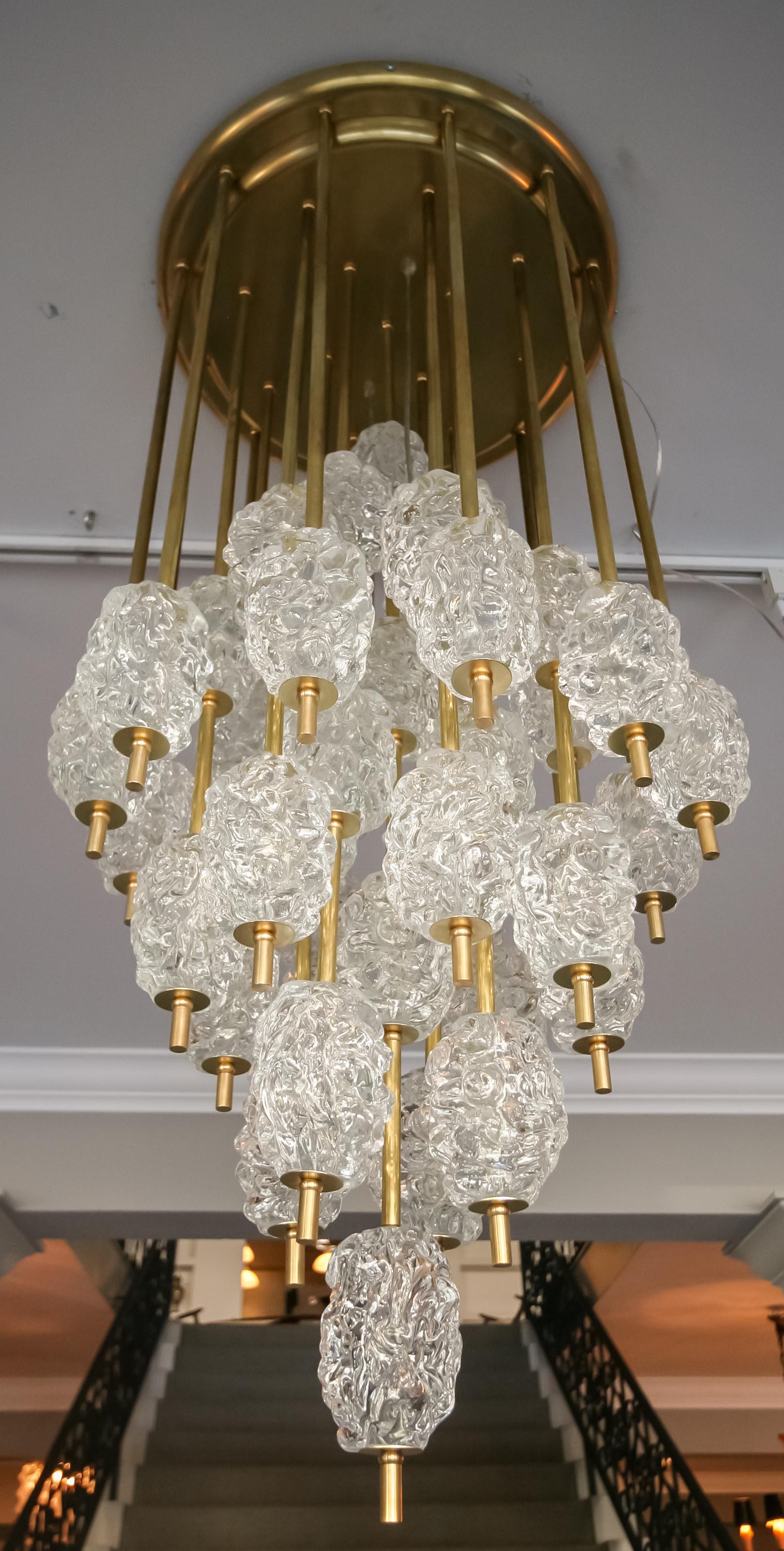 Diamant chandelier in the style of Barovier e Toso 1970s with brass frame and textured transparent glass.