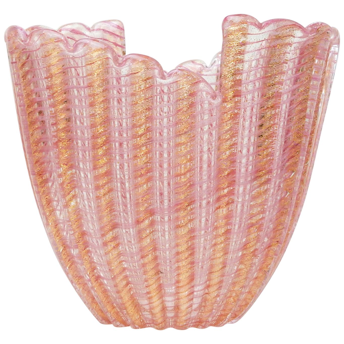 Gorgeous Murano art glass vase designed by Ercole Barovier for Barovier e Toso . 
Hand blown gold flecks and cotton candy pink stripes through a ribbed sides with asymmetrical edge.
Flawless condition.