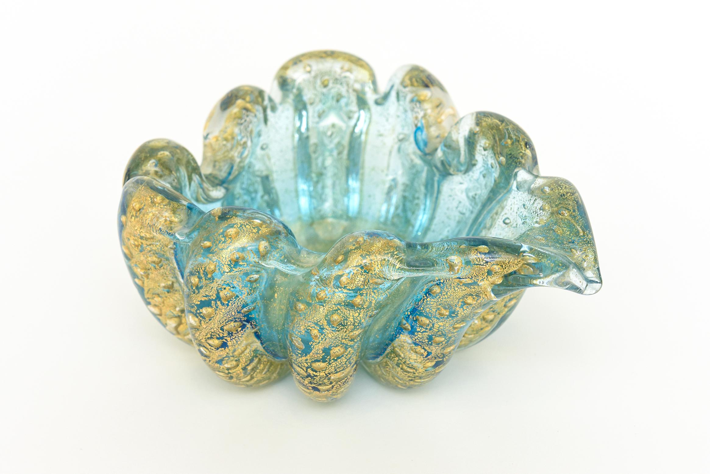 This stunning and magnificent color of sea mist turquoise and gold in this vintage Murano Italian Mid-Century Modern bowl is by the maestros; Barovier e Toso. It is of the Cordonato d' Oro technique where twisted ropes of gold are applied in each