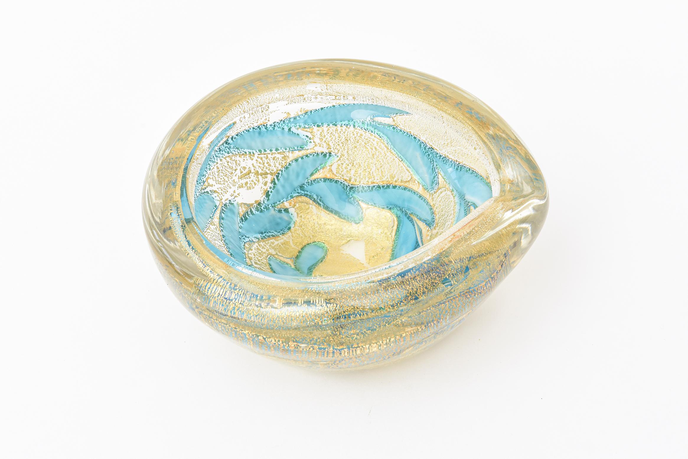 This absolutely stunning and unusual Italian Barovier e Toso Murano glass bowl is filled with abstract segments of blown turquoise powder splattered painterly in the glass mixed with abundant gold aventurine. An abstract design has come from this