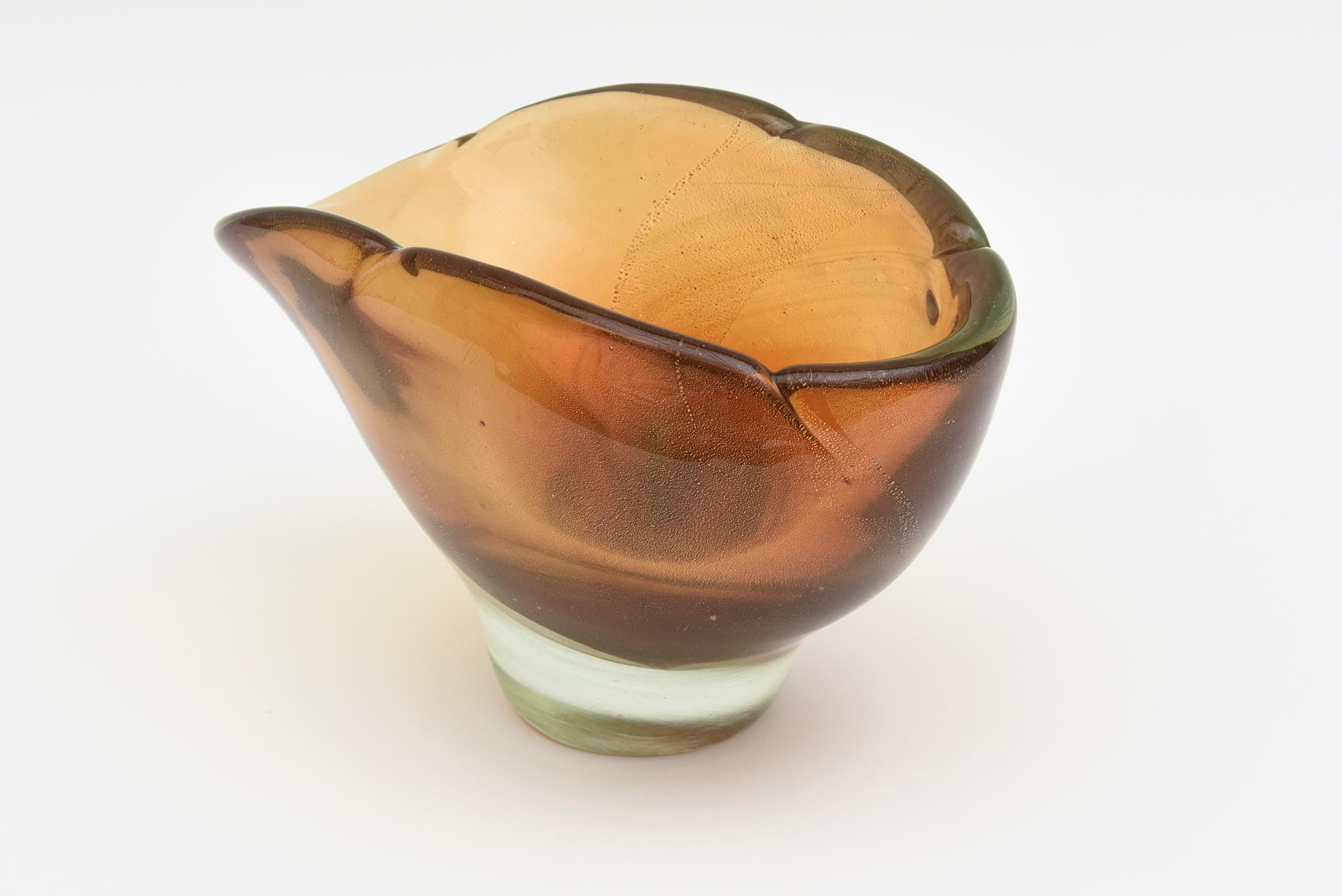 This stunning thick walled Italian vintage Murano hand blown glass bowl by Barovier & Toso is large. It is an early piece from the late 40's early 50's. The colors range from amber to light brown in sommerso form with flecks of gold aventurine in