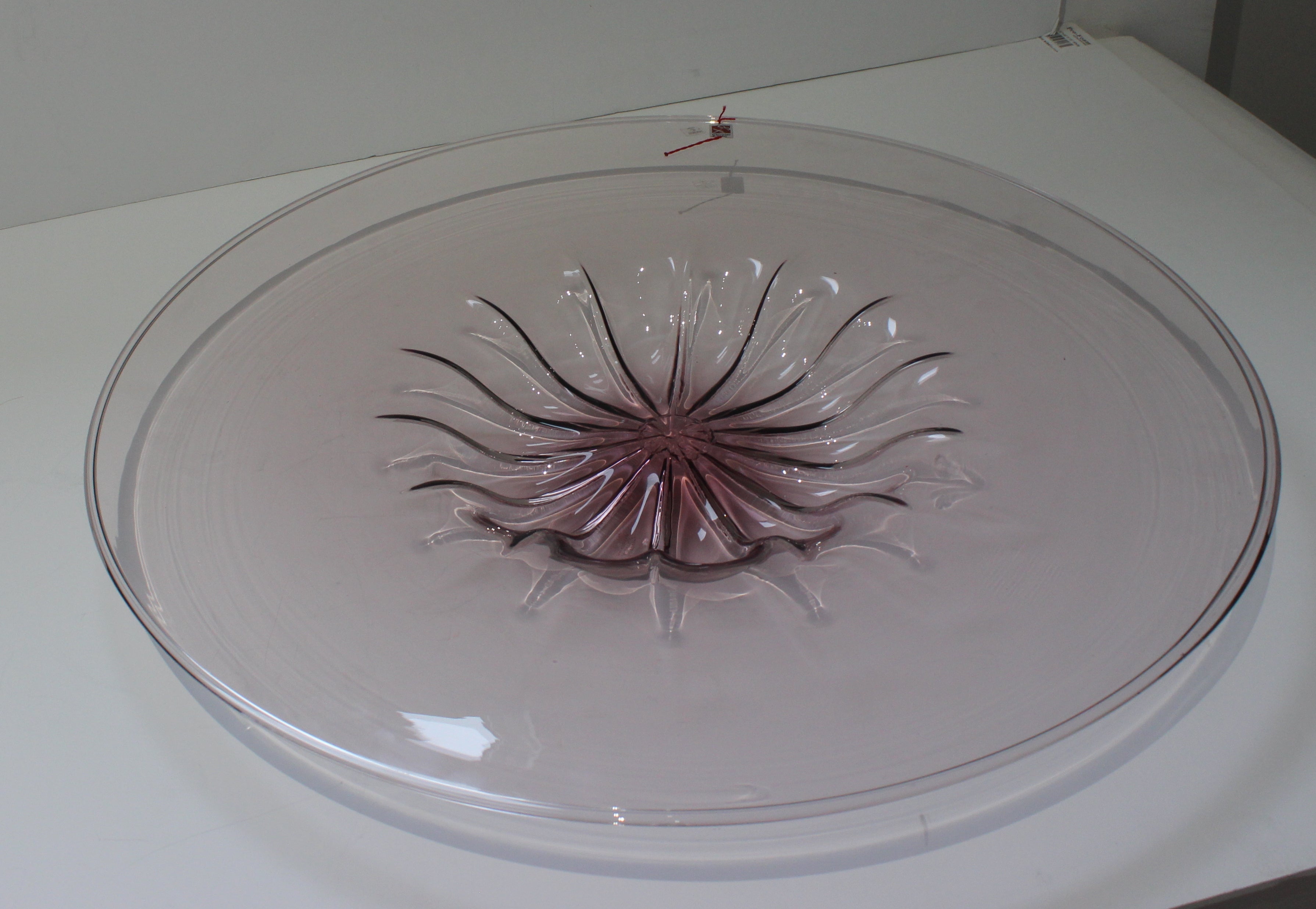 This large scale, violet colored Murano glass dish dates to the 1980s and was created by Barovier et Toso. 

Note: The piece retains its origianl makers labels and is signed on the verso.