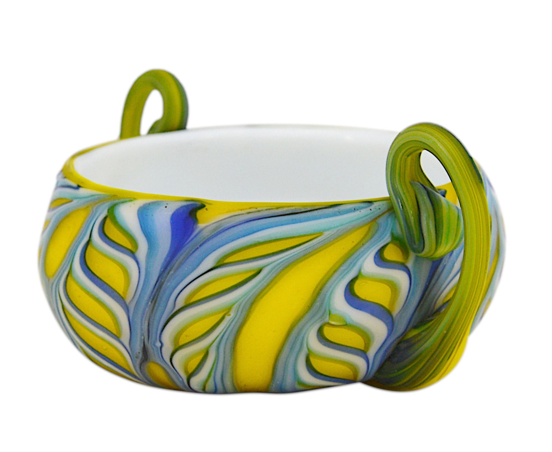 Fenicia bowl by Barovier, Murano, ca.1900. Blown double glass. Yellow, blue, green and white glass. 2 hot-applied handles. Measures: height: 1.6