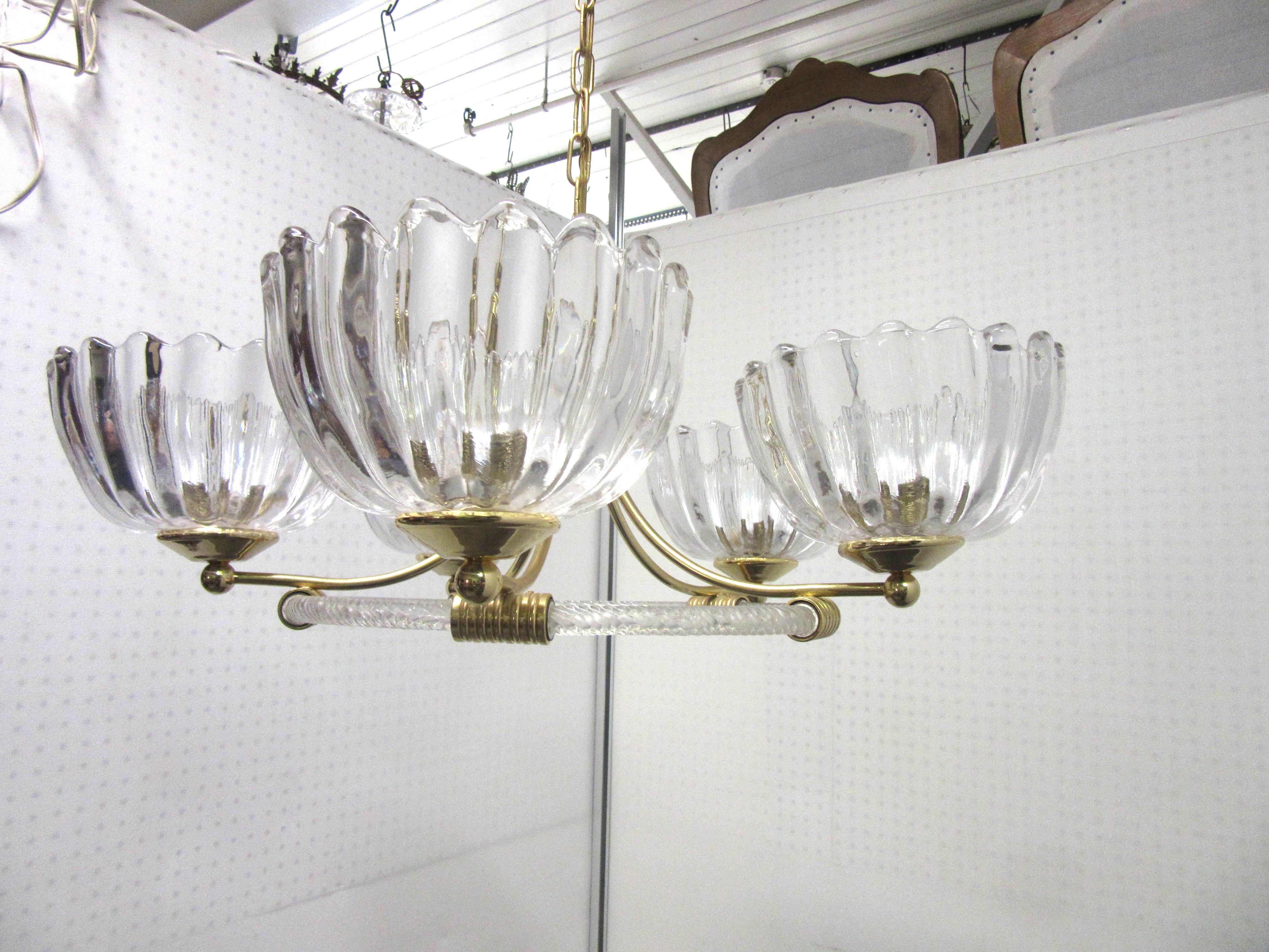 Italian Mid-Century Modern hand blown circle chandelier with 5 thick and heavy shades, made by Barovier. There are brass rings and a canopy as well as screw mounts for the shades. The shades measure 5” high, and 9” diameter. There is an additional