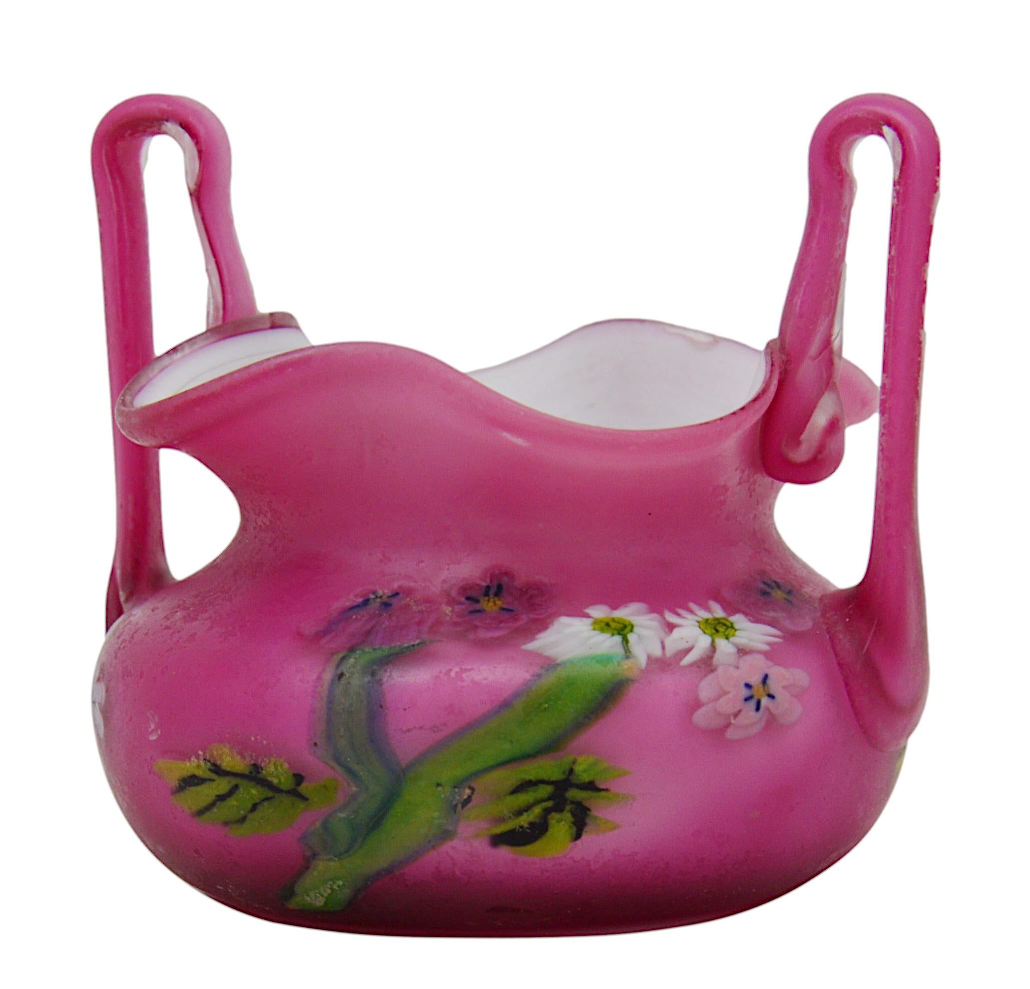 Millefiori bowl by Barovier, Murano, ca.1900. White and fuchsia double-layered glass. Inlaid polychrome millefiori and canes. 2 hot-applied handles. Height: 2.5