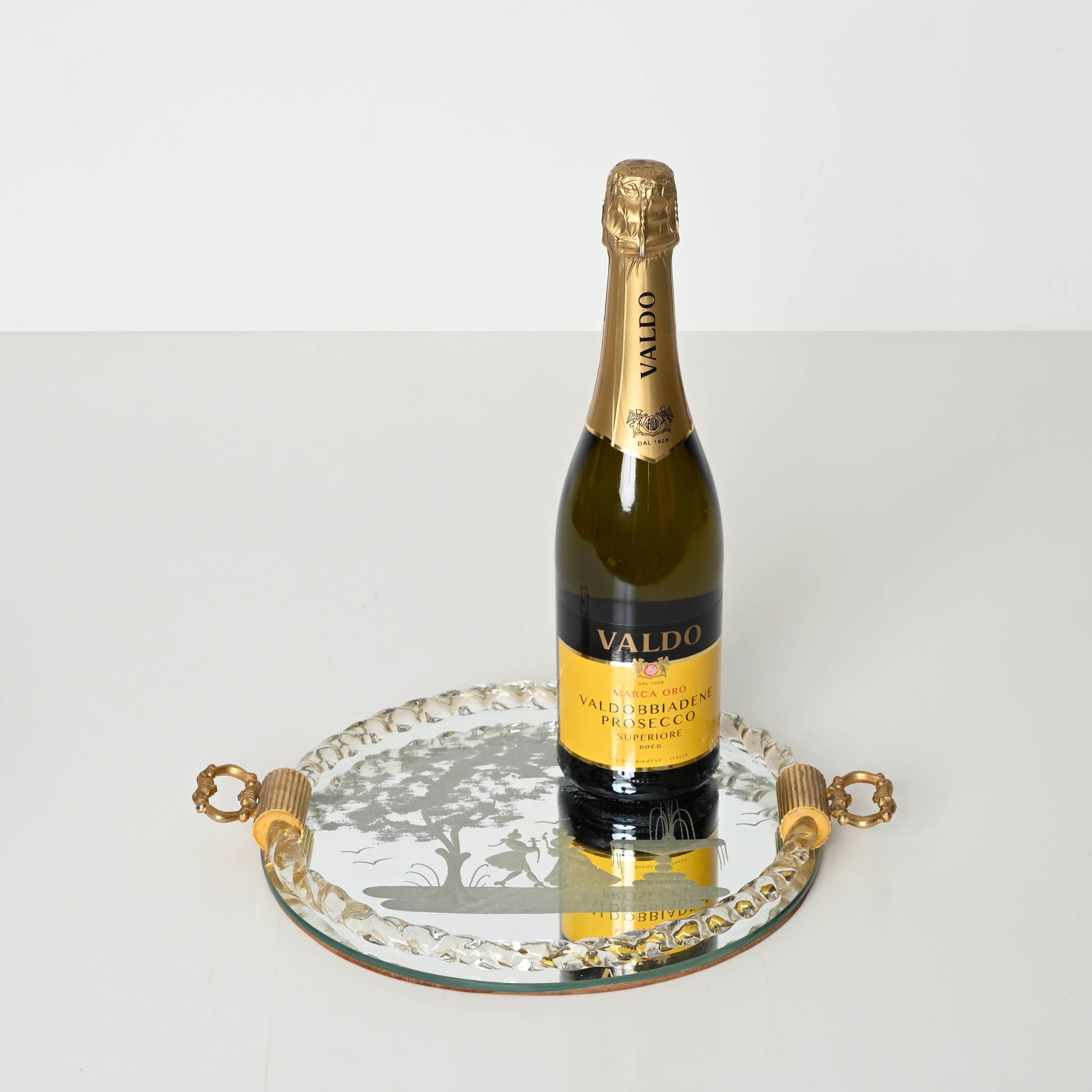 Delightful serving tray in a stunning combination of mouth-blown Murano glass with gold specks inside, acid-etched mirror and gilt metal handles. This gorgeous piece was produced in Italy during the 1940s by the master Murano glass-maker Ercole