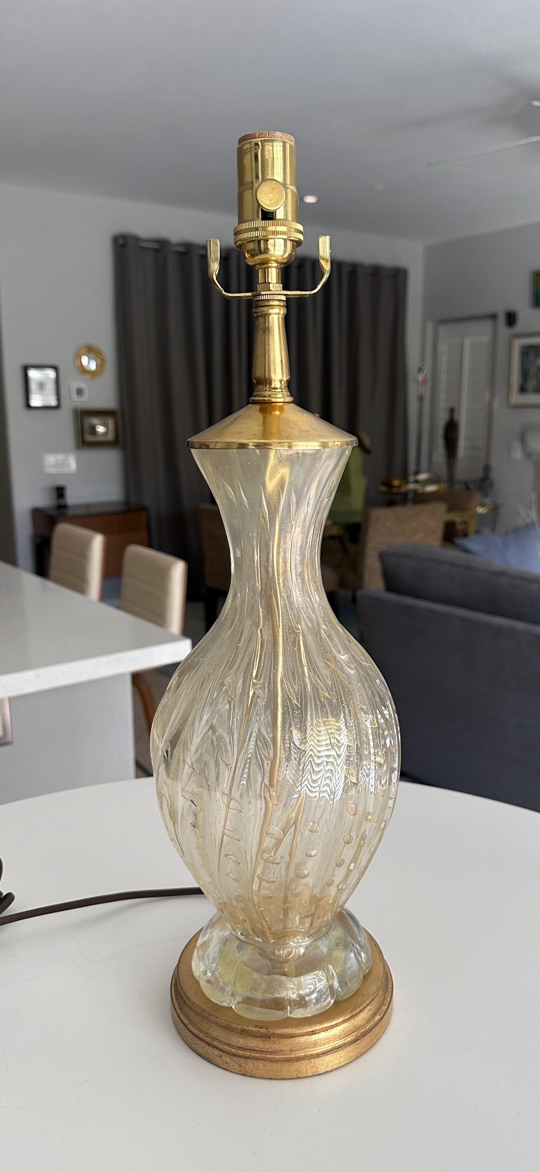 Murano Italian hand blown gold inclusions ribbed glass table lamp with. The blown glass has controlled bubbles throughout, along with a partial opalescence coating running along the top neck portion. The heavy expertly constructed blown glass rests