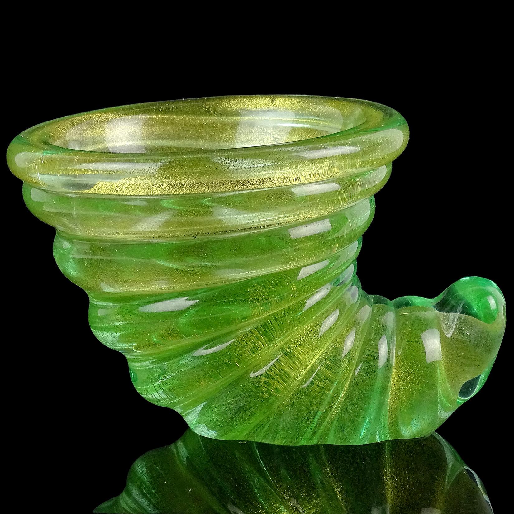 Priced Per Item (4 available). Beautiful vintage Murano hand blown green and gold flecks Italian art glass twisting seashell dishes / sculptures. Documented to the Barovier e Toso company, with original label on one of them (see photo). The mouth of