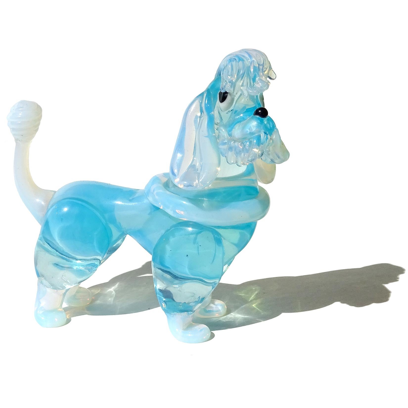 Very cute Murano hand blown opalescent white and blue Italian art glass poodle dog figurine. Attributed to the Barovier e Toso company, circa 1960s. The puppy is incredibly well sculpted, highly detailed with great character. Measures 5 3/4
