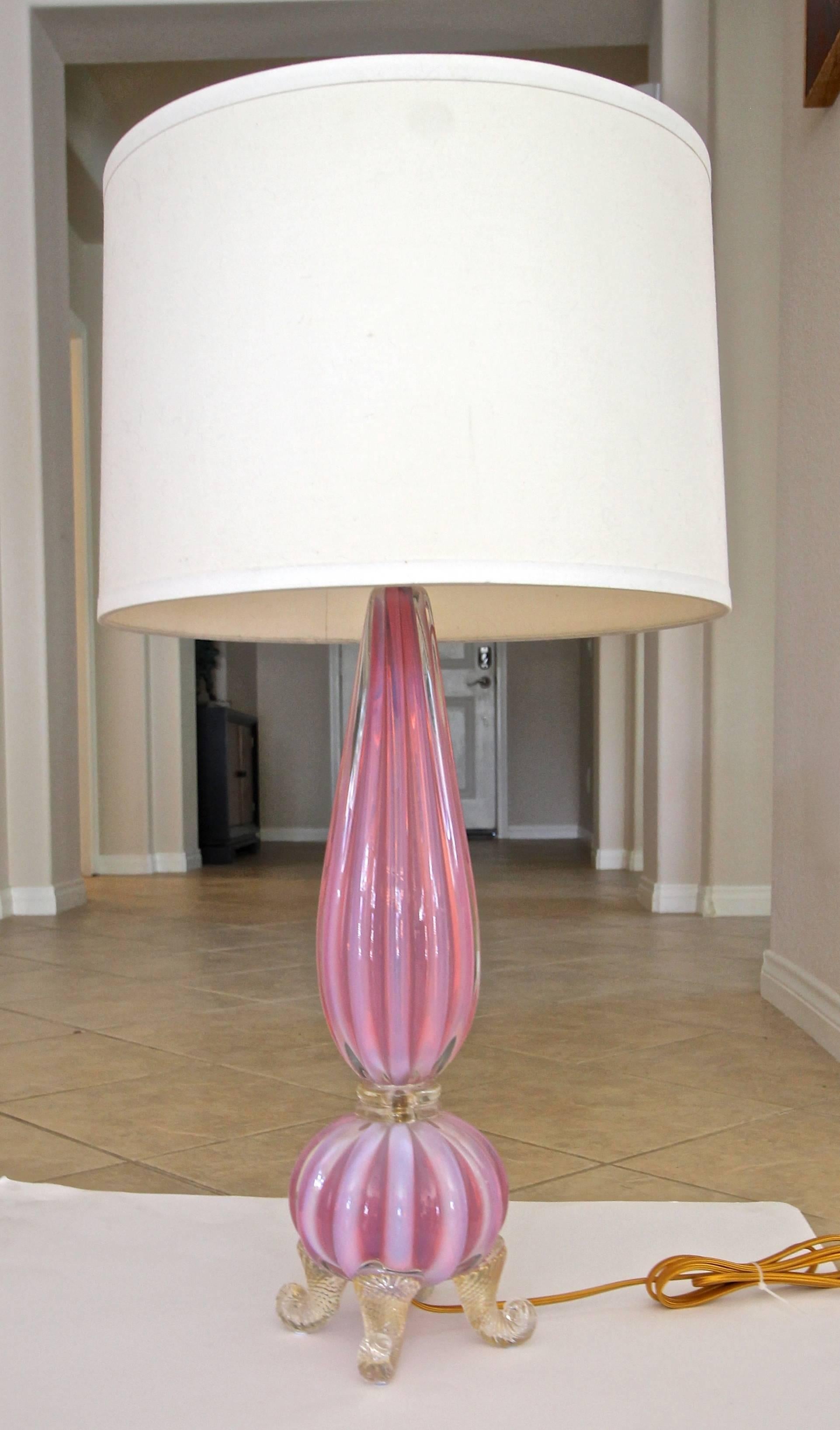 Murano Italian handblown pink or salmon opalescent ribbed glass table lamp with gold inclusions resting on footed base by Barovier & Toso. The opalescent color is combination of opaque striped ribs alternating with pink/salmon. New brass fittings