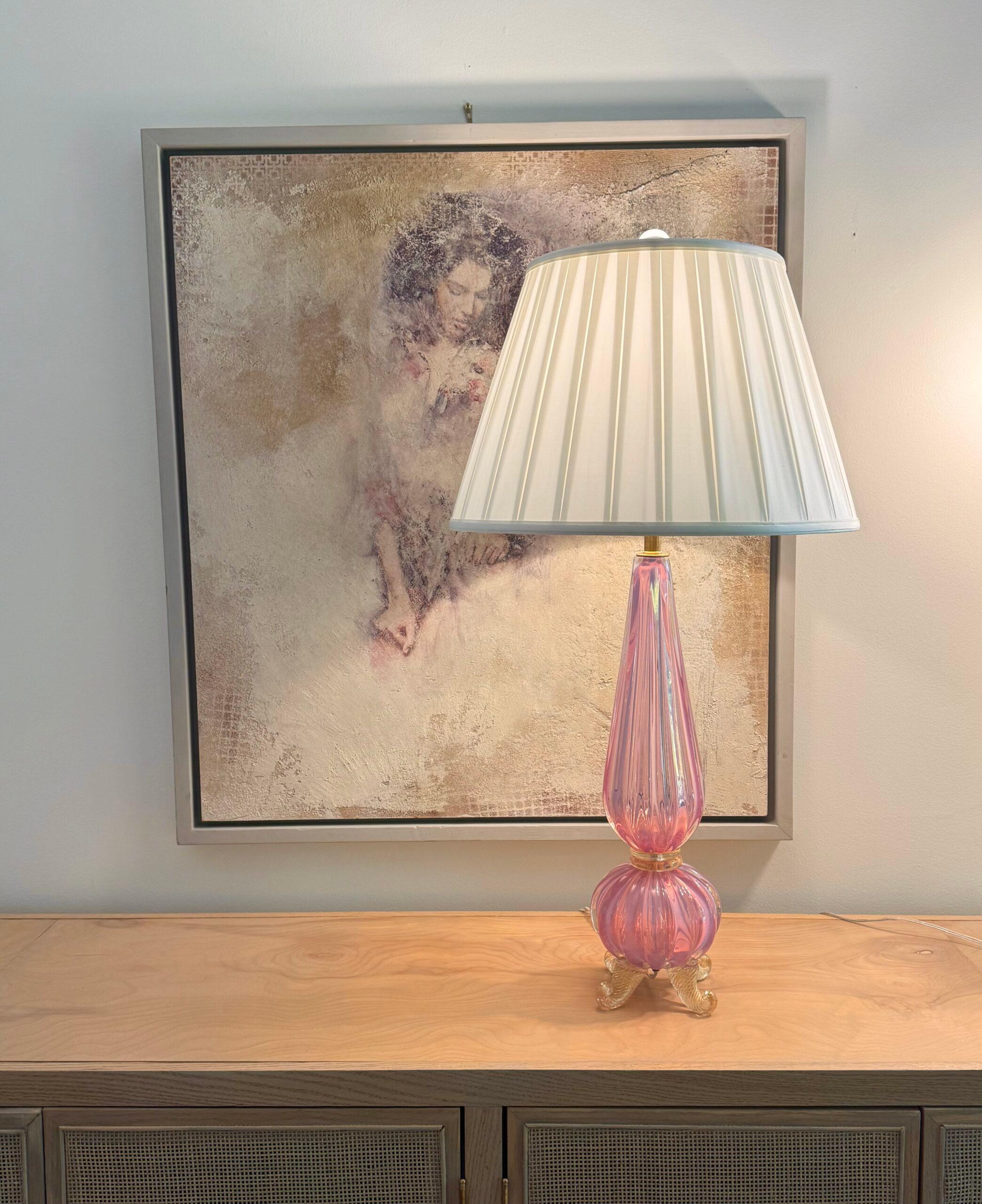 RARE and amazing footed lamp by Barovier and Toso; one of the oldest and most well-known glass makers in Murano. Ribbed pink opaline filled with gold dust, makes this lamp a true show piece. A very hard to find piece!

The lamp stands 26 inches to