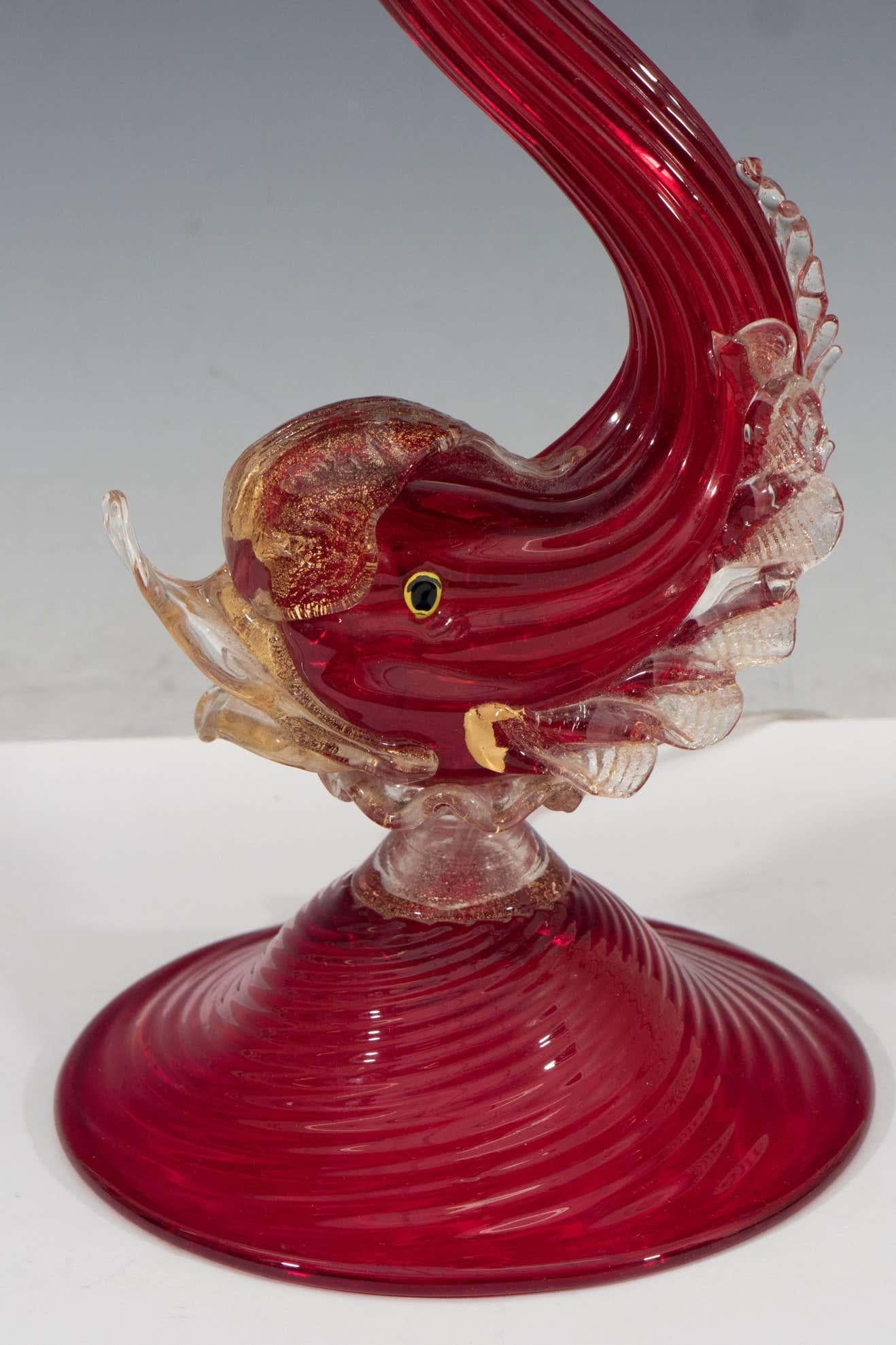 Hollywood Regency style table lamp in Murano glass, attributed to Barovier e Toso and produced circa 1940s, designed as a red glass fish with applied clear polvere o’oro glass fins, lips and tail.

Dealer: S107AB