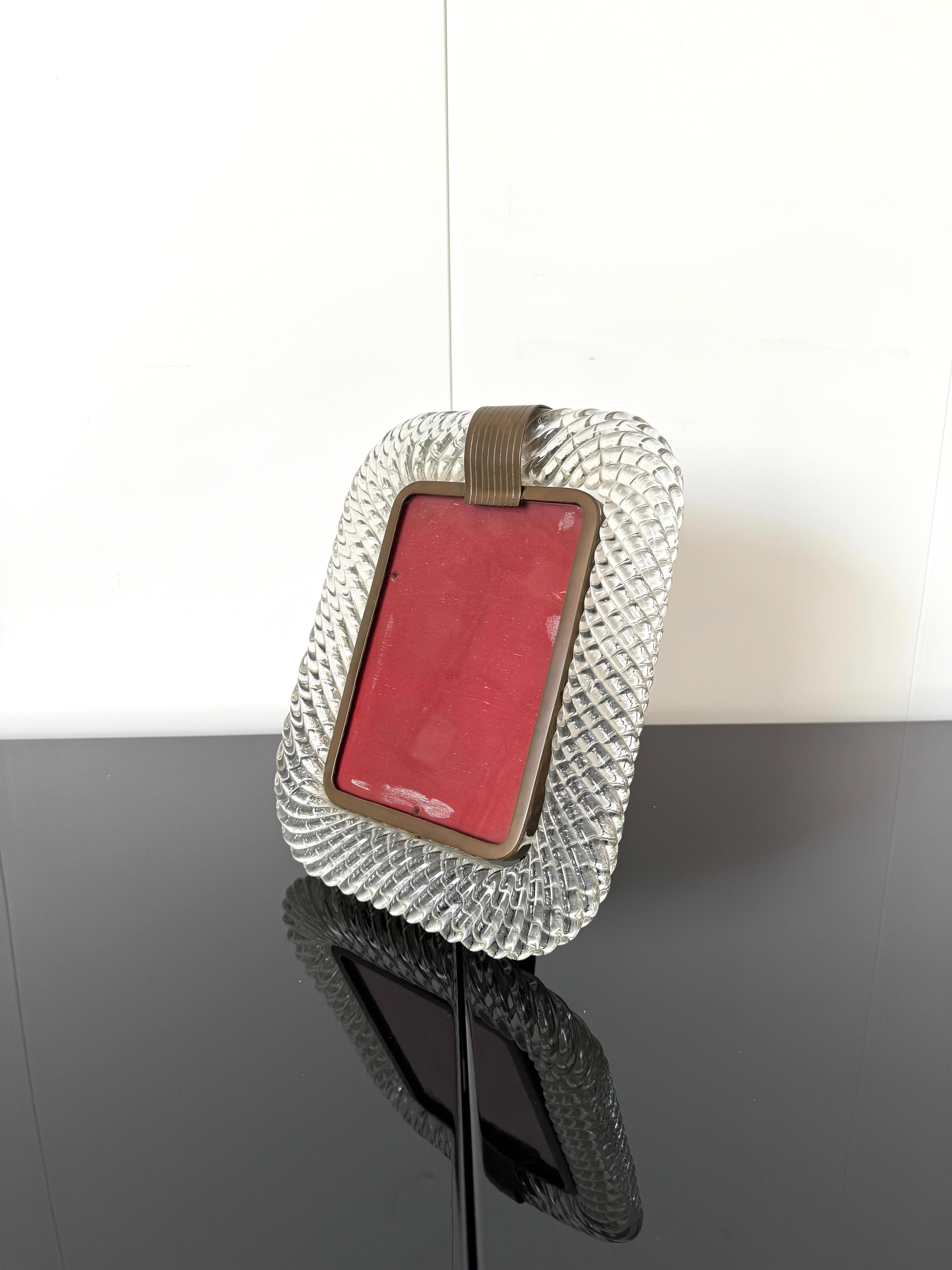 Photo frame 
Twisted Murano glass structure with brass frame and support, designed and manufactured by Barovier & Toso
1940ties
